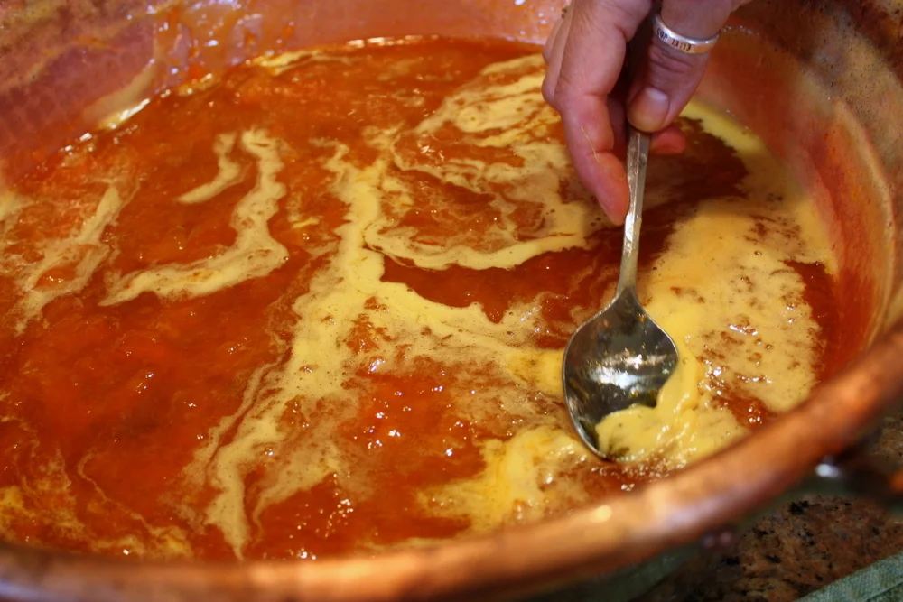  The residents took turns stirring (always one direction to minimize incorporating too much air) and scraping off the foam (which was not wasted - most folks took a taste). 