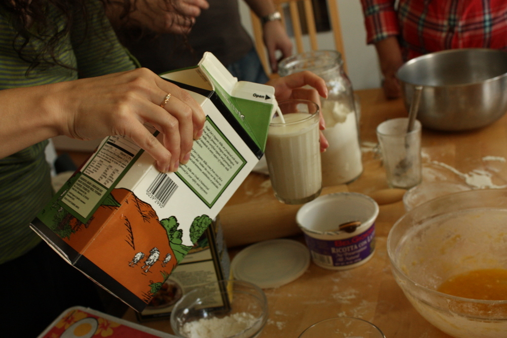  Here Irina measured out some milk. In Russian cooking, drinking glasses and cups are often used instead of actual measuring cups. 
