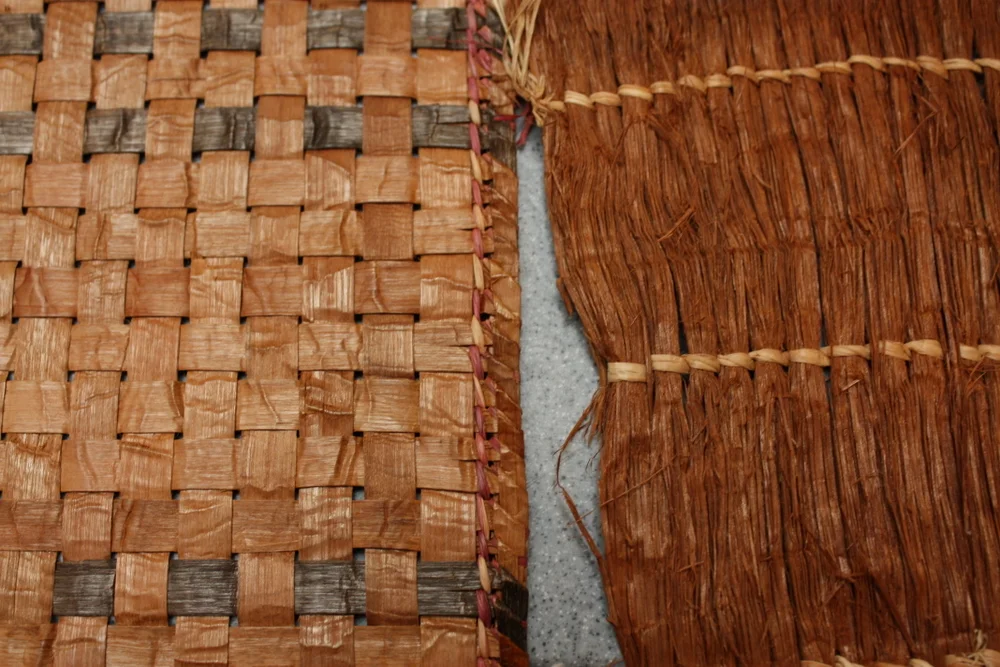  Two mats of redcedar. Right mat is the softer woven type that could be used for diapers. 