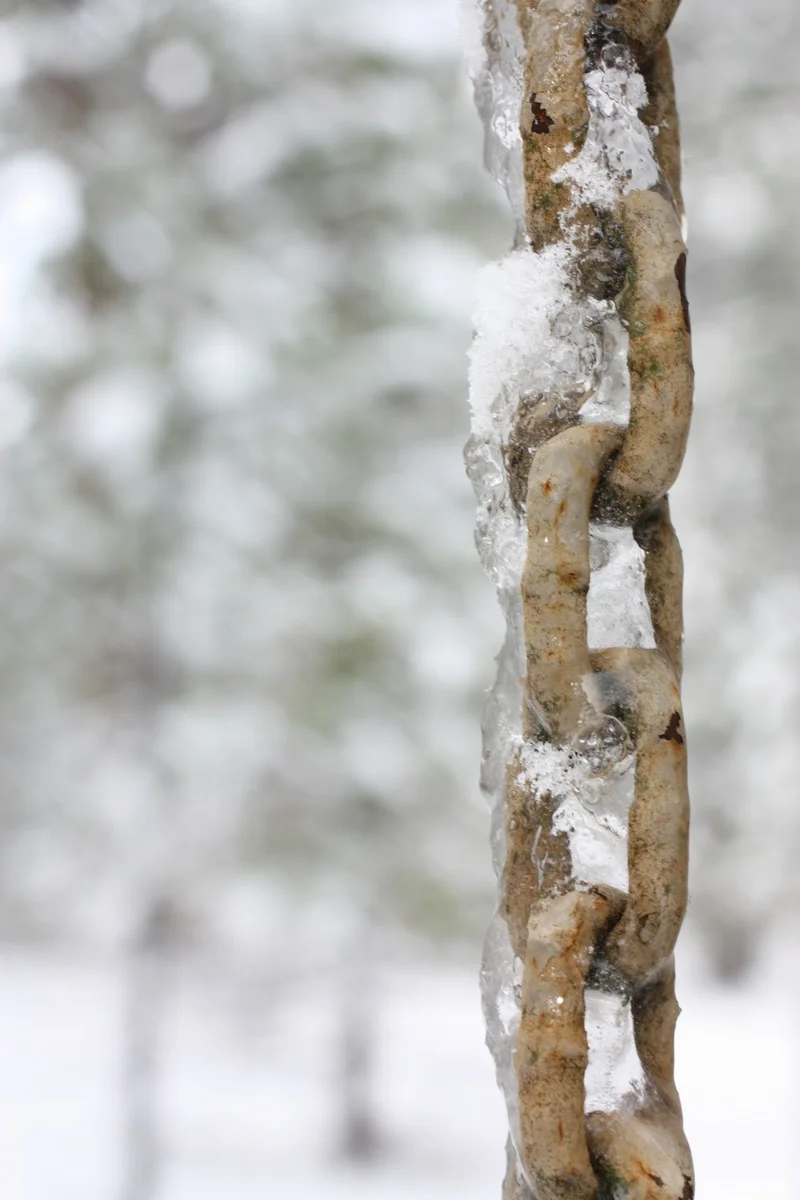  Water frozen on the chain hanging from the side of the house, which Heather later discovered are used to help drain water from the roof. 