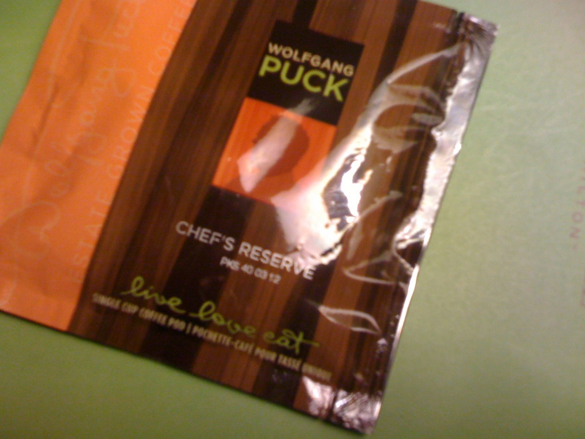  Heather noted she was excited to see Wolfgang Puck coffee in the room until she noticed something we dislike about as much as the misuse of "it's" on the corncob sign: a three-word tagline of floofy-poofiness "live love eat." 