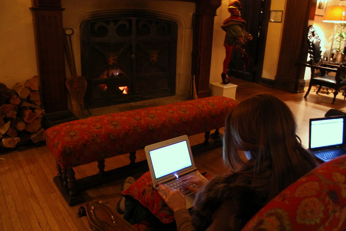  Heather and I NaNoWriMoing by the fire in the lobby. 