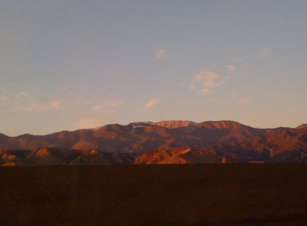  We listened to the excellent audiobook version of The Grapes of Wrath (occupy Oklahoma!) until evening fell, stopped for one final road snack of junk food, and finally rolled into Valley of the Sun after dark. We were technically 15 minutes ahead of