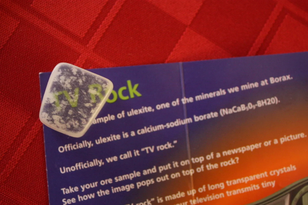  One of the (surprisingly many) staffers at the visitor center gave us a sample of ulexite, AKA "TV rock." Per wikipedia: "The fibers of ulexite act as optical fibers, transmitting light along their lengths by internal reflection. When a piece of ule