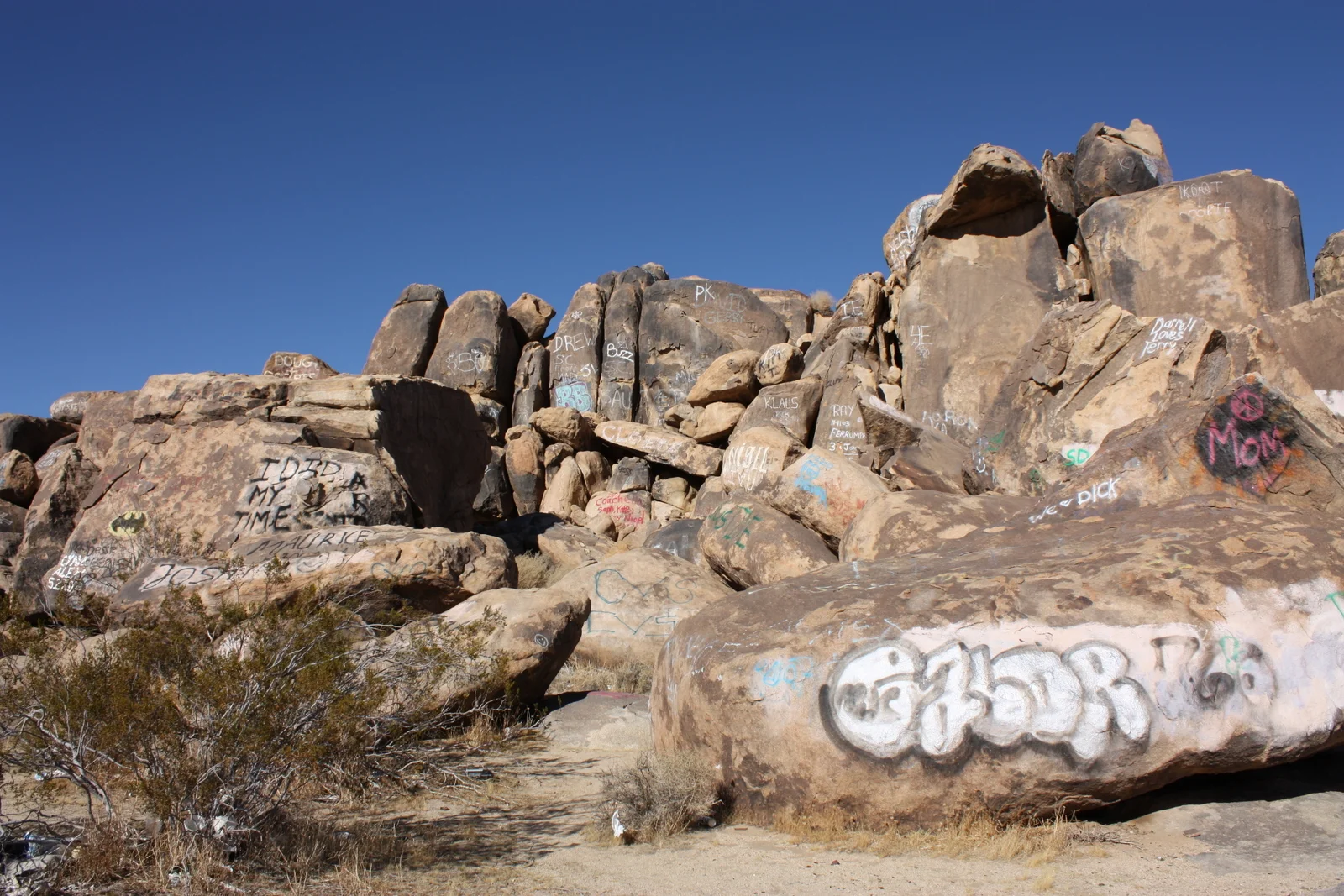  Onward through the desert of California, past this mass of rocks in the middle of near-nowhere covered in graffiti. My favorite part is the "I DID MY TIME" painted over by the Batman symbol at left. 