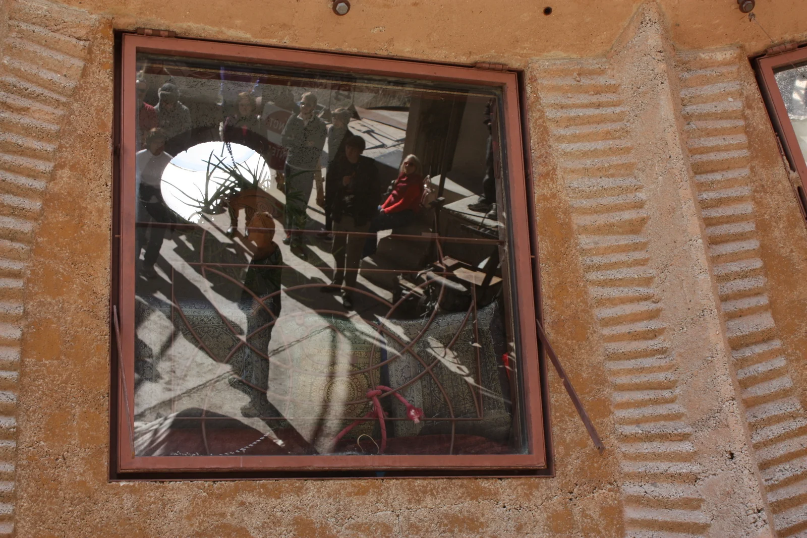  The bronze-casting apse had a bunch on inset windows in the dome, which looked in on one of the living spaces. Our guide (reflected in window) actually lives in this space. 