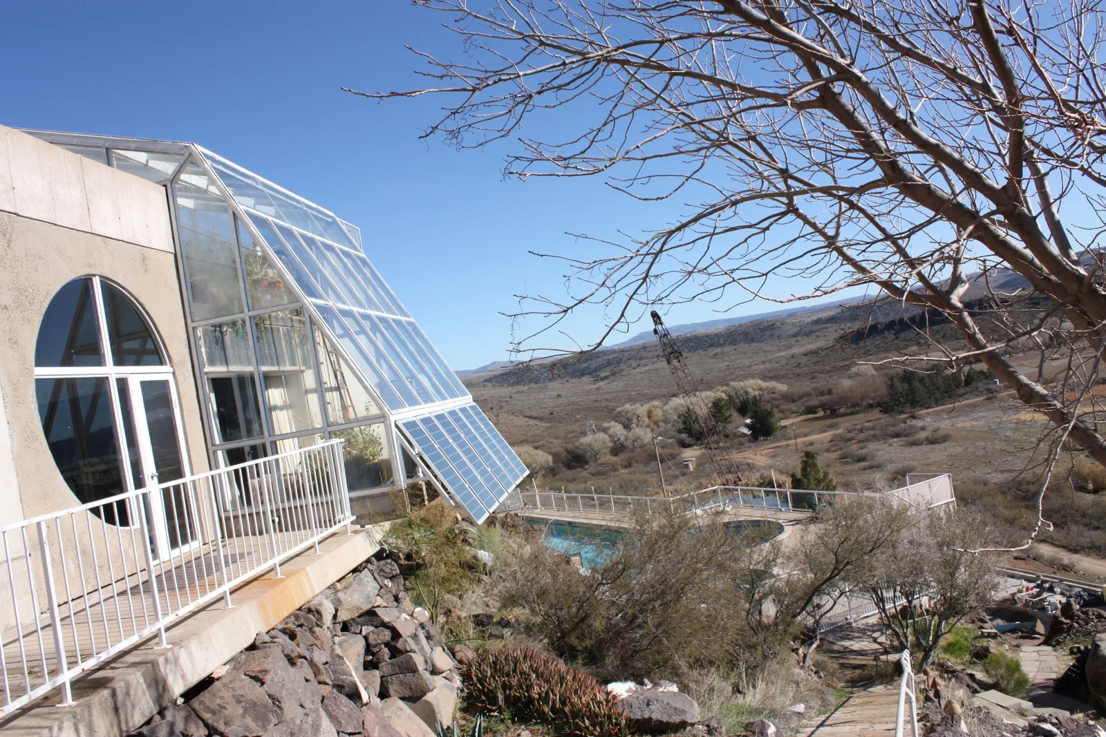  A space used as an office, with some solar panels, overlooking a pool, below that a...sewage pool of sorts? (I missed the explanation of how that works but somehow not disappointed by that.) Beyond that the fields that could be used for agriculture 