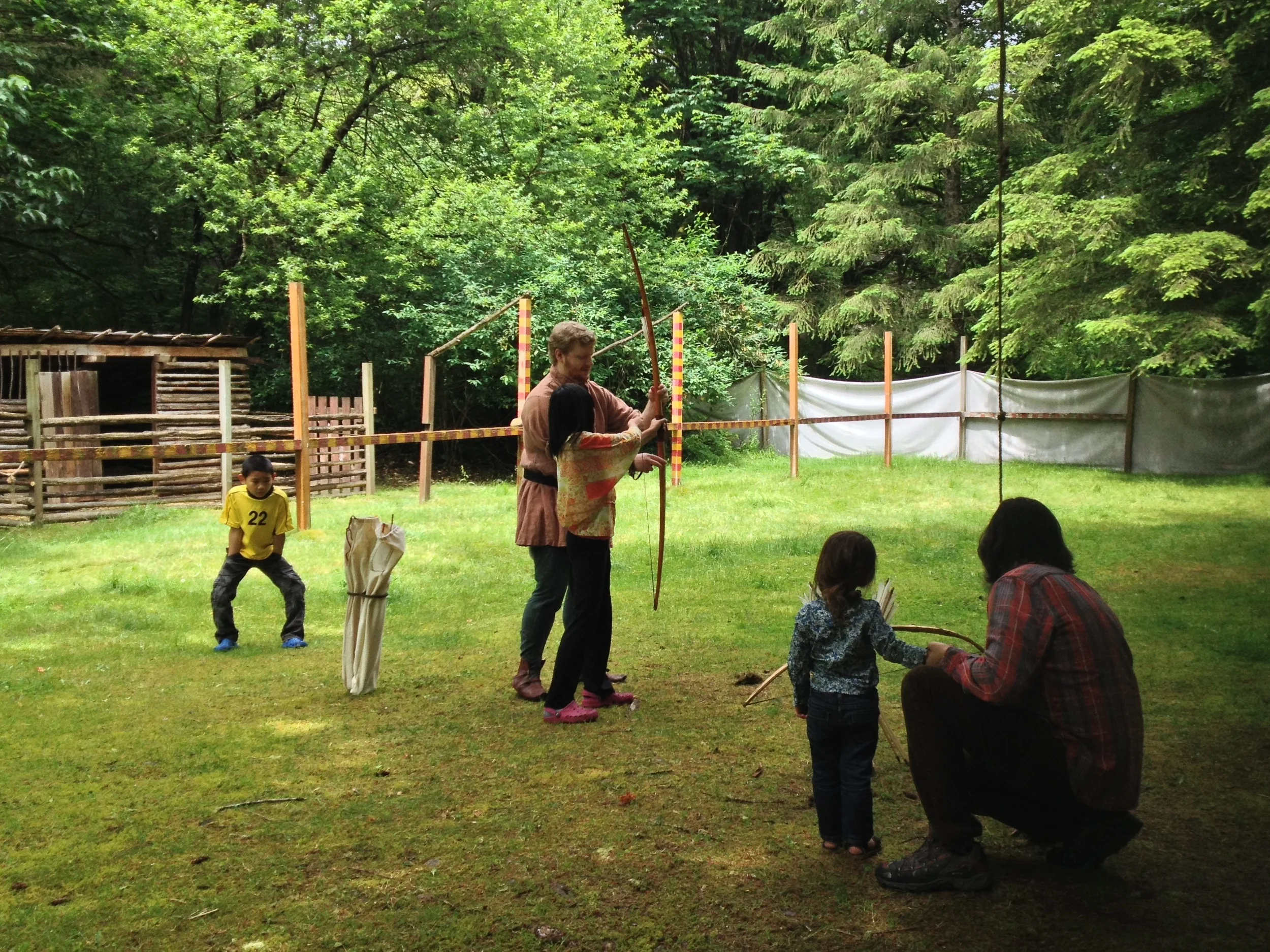  Hazel being held back from highly enthusiastic handholding with her new best friend (in pink crocs) who was taking a turn at the bow. 