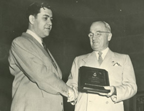   President Truman awards George E. Barr the 1951 President’s Award for his contribution to employment of people with disabilities.  