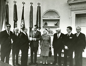   Jeremiah Milbank, Jr. and Margaret Milbank Bogert, son and daughter of the founder, meet with President Nixon in the Oval Office in 1970.  