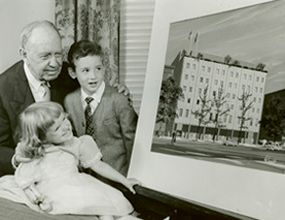   Founder Jeremiah Milbank Sr. looks at new building plans with pediatric patients in 1962.  