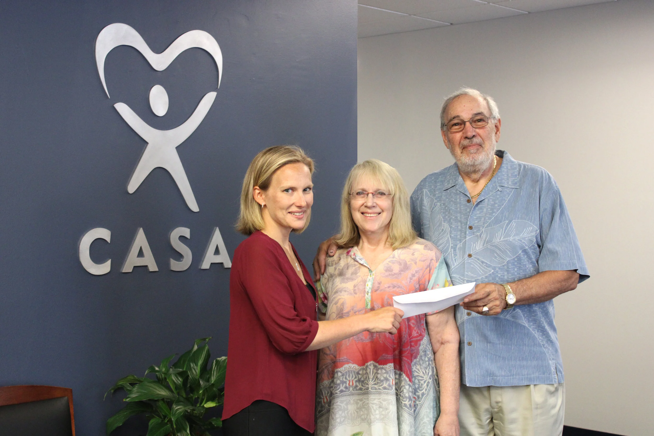 Pam and Craig Goldman with Erica July 2019.jpeg