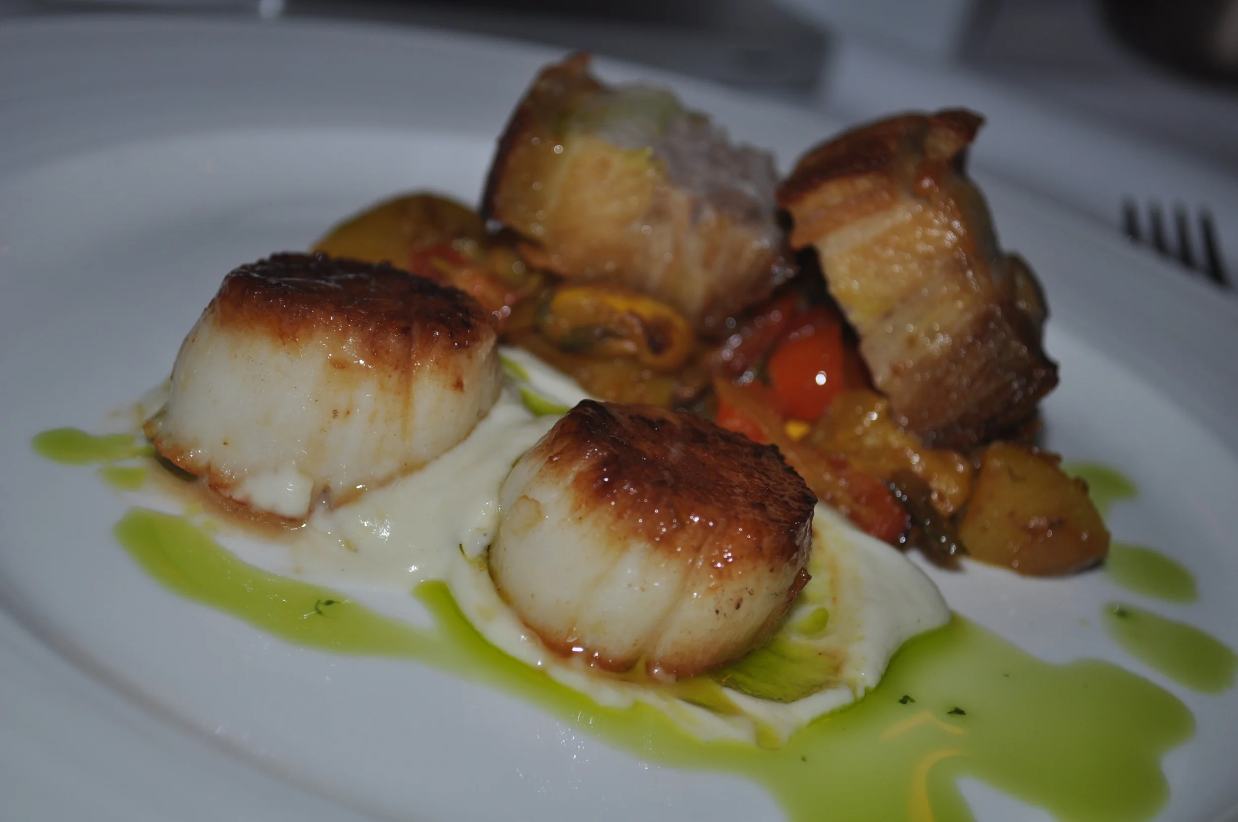 A Different Surf &amp; Turf pairs scallops and pork belly.