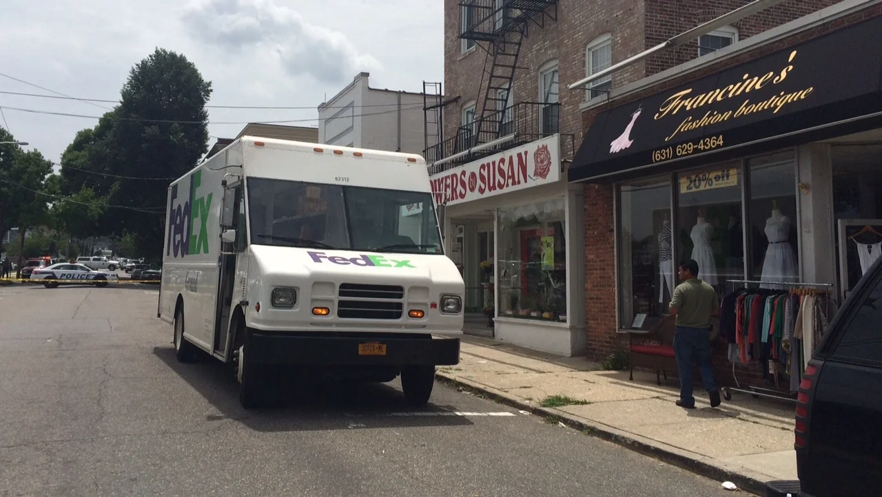 Spilled Bottles in FedEx Truck Closes Street