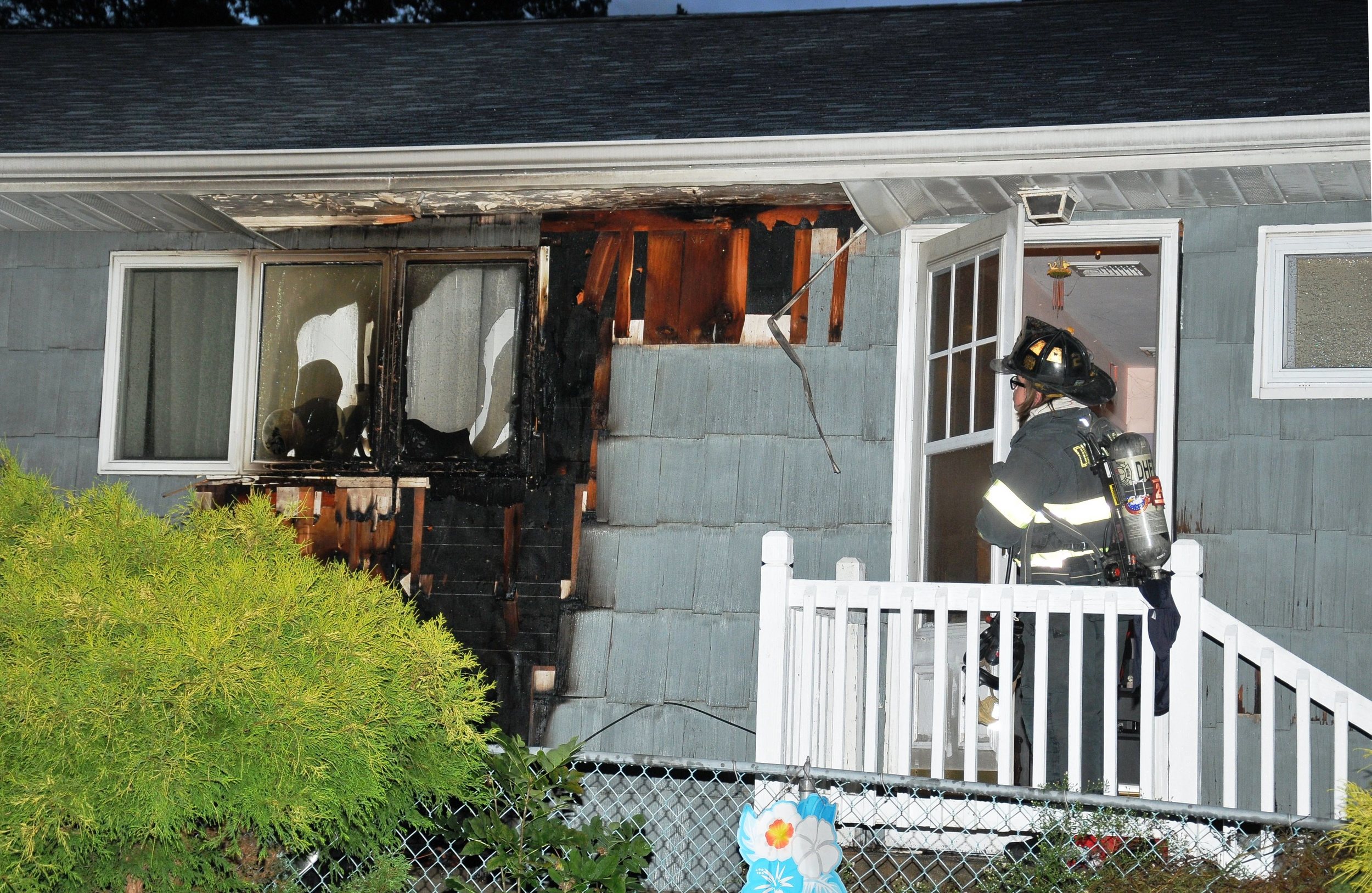 A Dix Hills home was damaged when a barbecue fire spread to the house's exterior. Photo by Steve Silverman