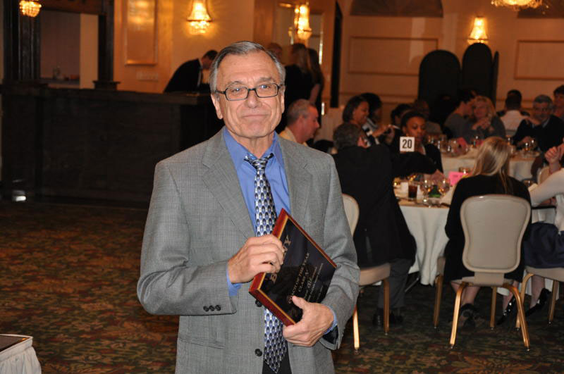 Elwood-John Glenn girls varsity basketball coach Andrew “Andy” Athanas, pictured during a Basketball Coaches Association of New York ceremony, will be inducted into the BCANY’s basketball hall of fame March 13, 2016.