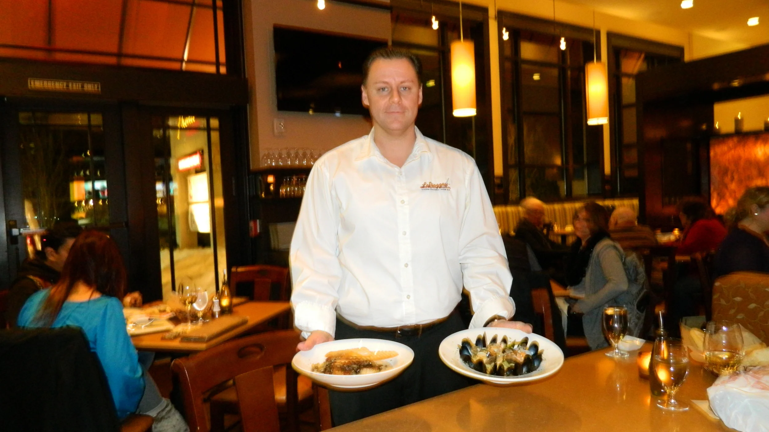 Managing Partner Thomas Sexton presents linguine di mare and scallops alla Regina entrees