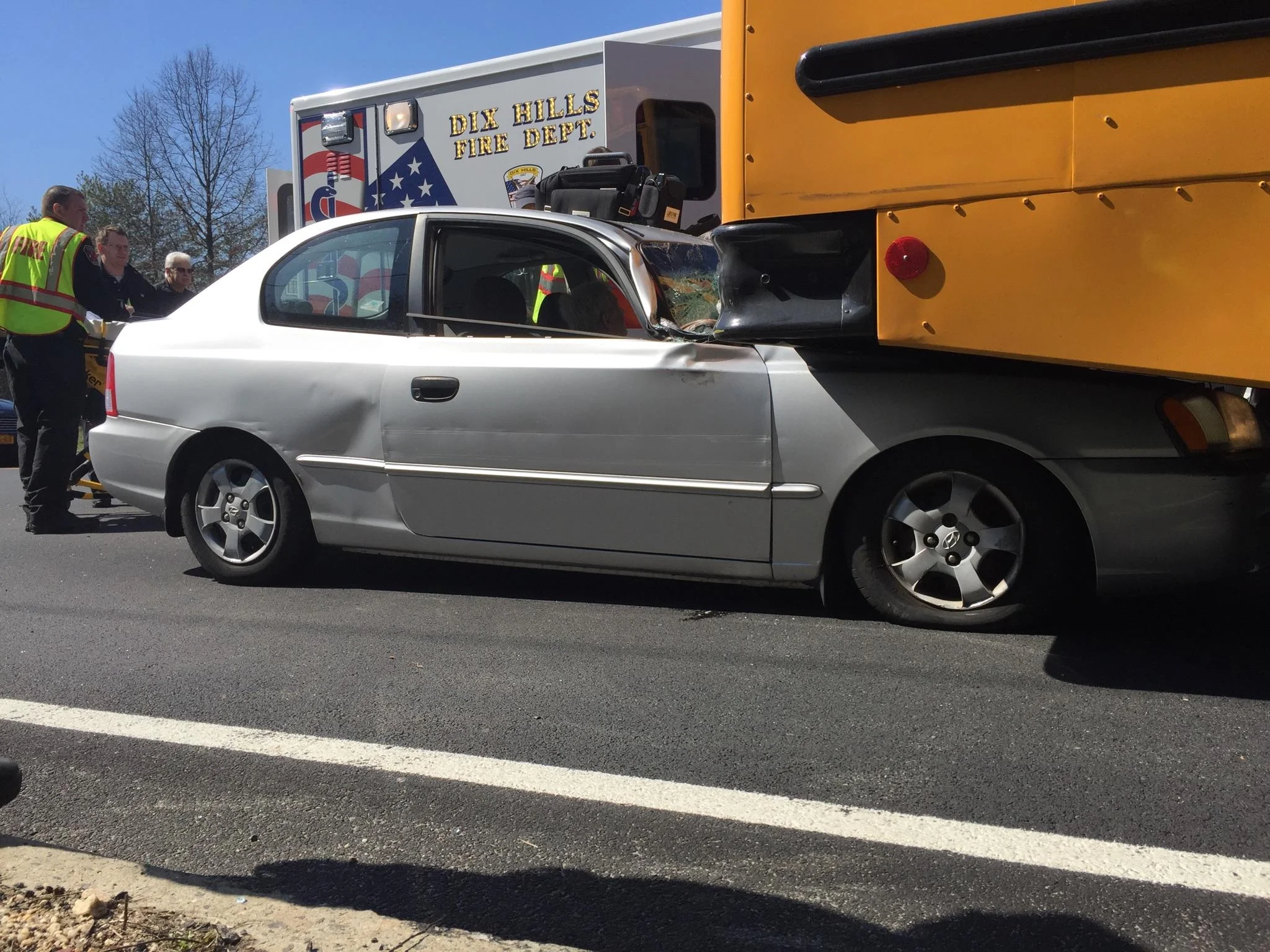 Suffolk police and fire officials said a 91-year-old Wheatley Heights man crashed his car into a school bus in Dix Hills last Thursday. Photo courtesy of Dix Hills Fire Department