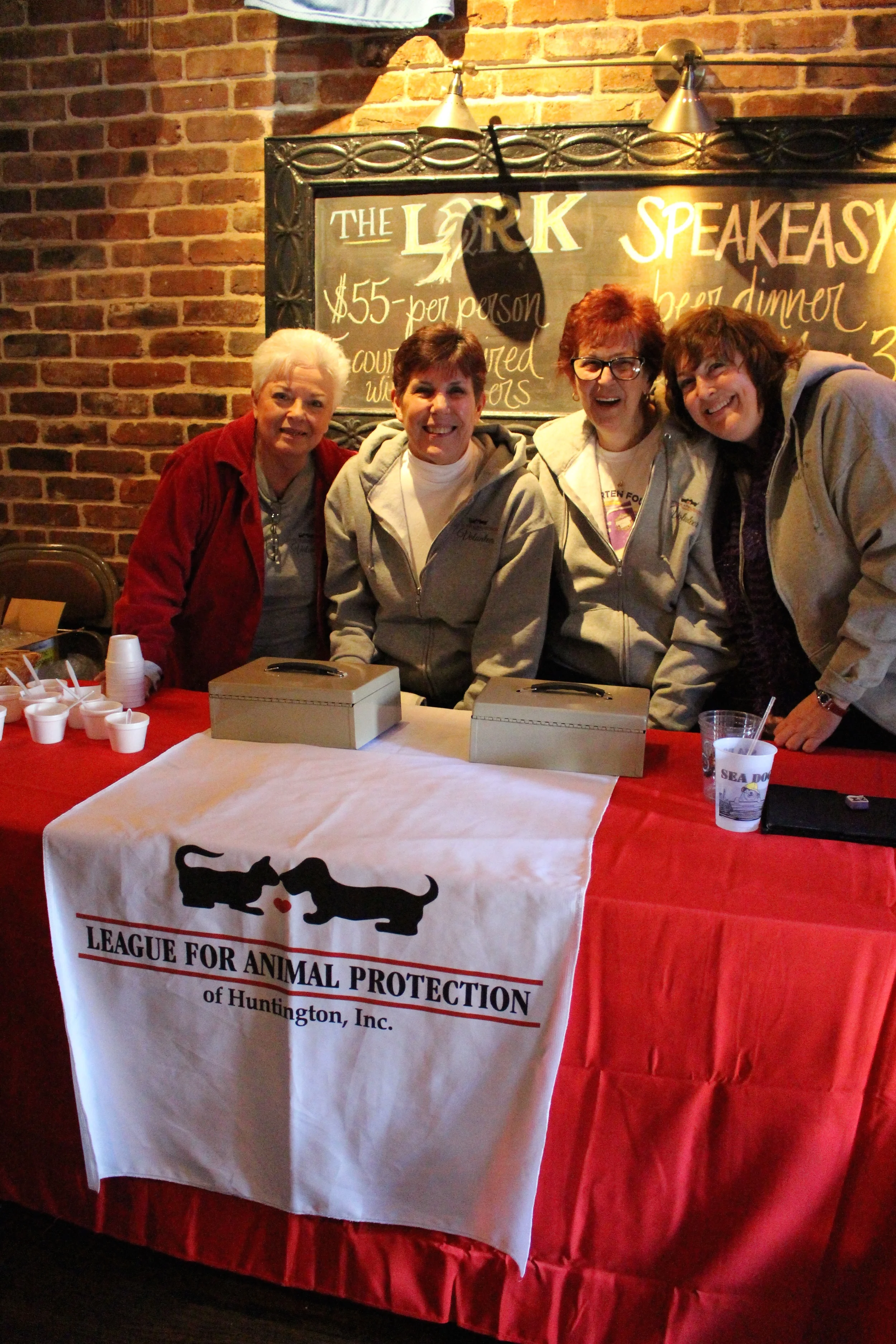 Members of The League for Animal Protection of Huntington are stationed at the front of The Lark Pub & Grub to collect donations during the fourth annual chili cook-off.