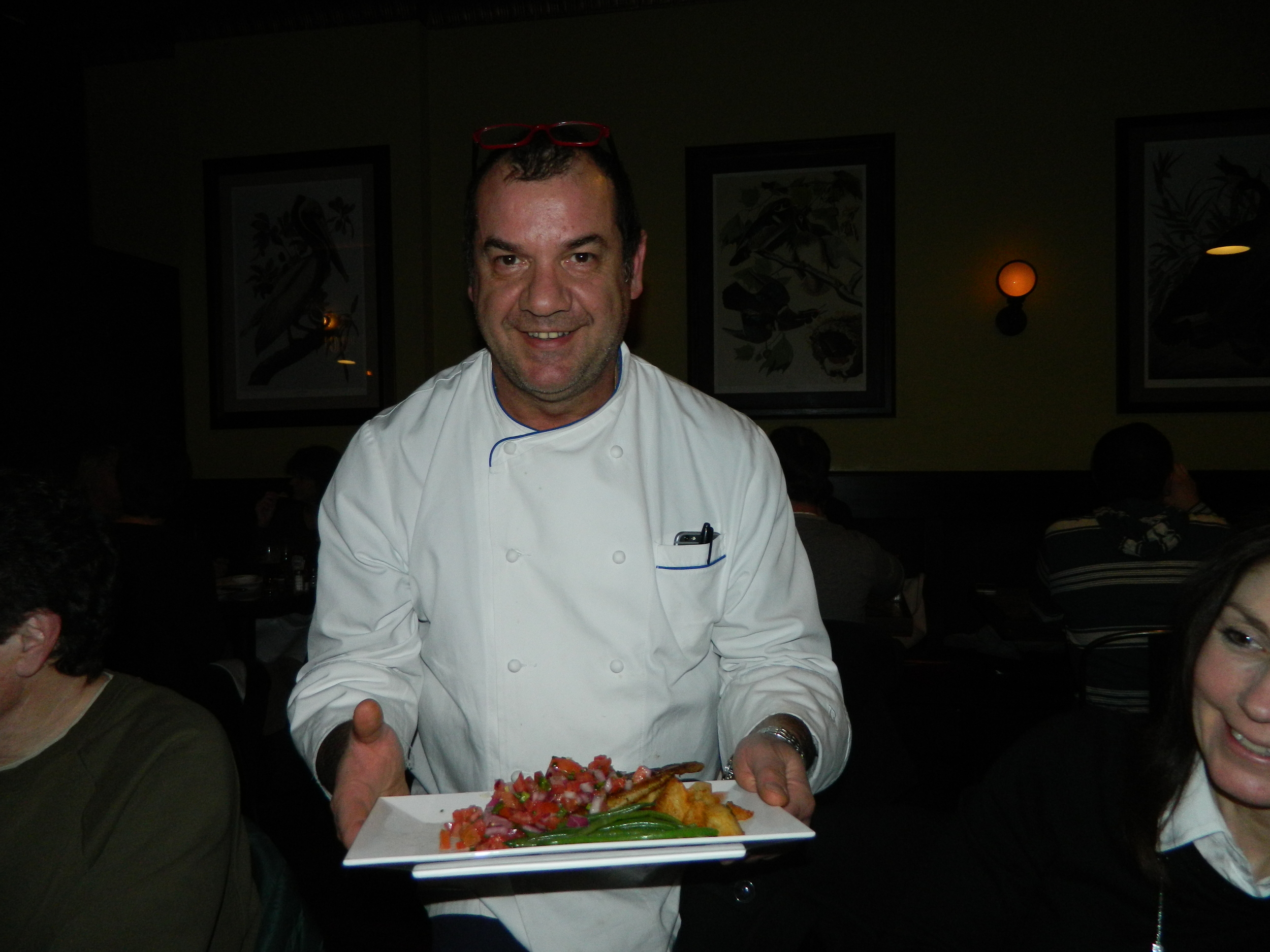 Owner and Executive Chef Nino Antuzzi presents blackened catfish.