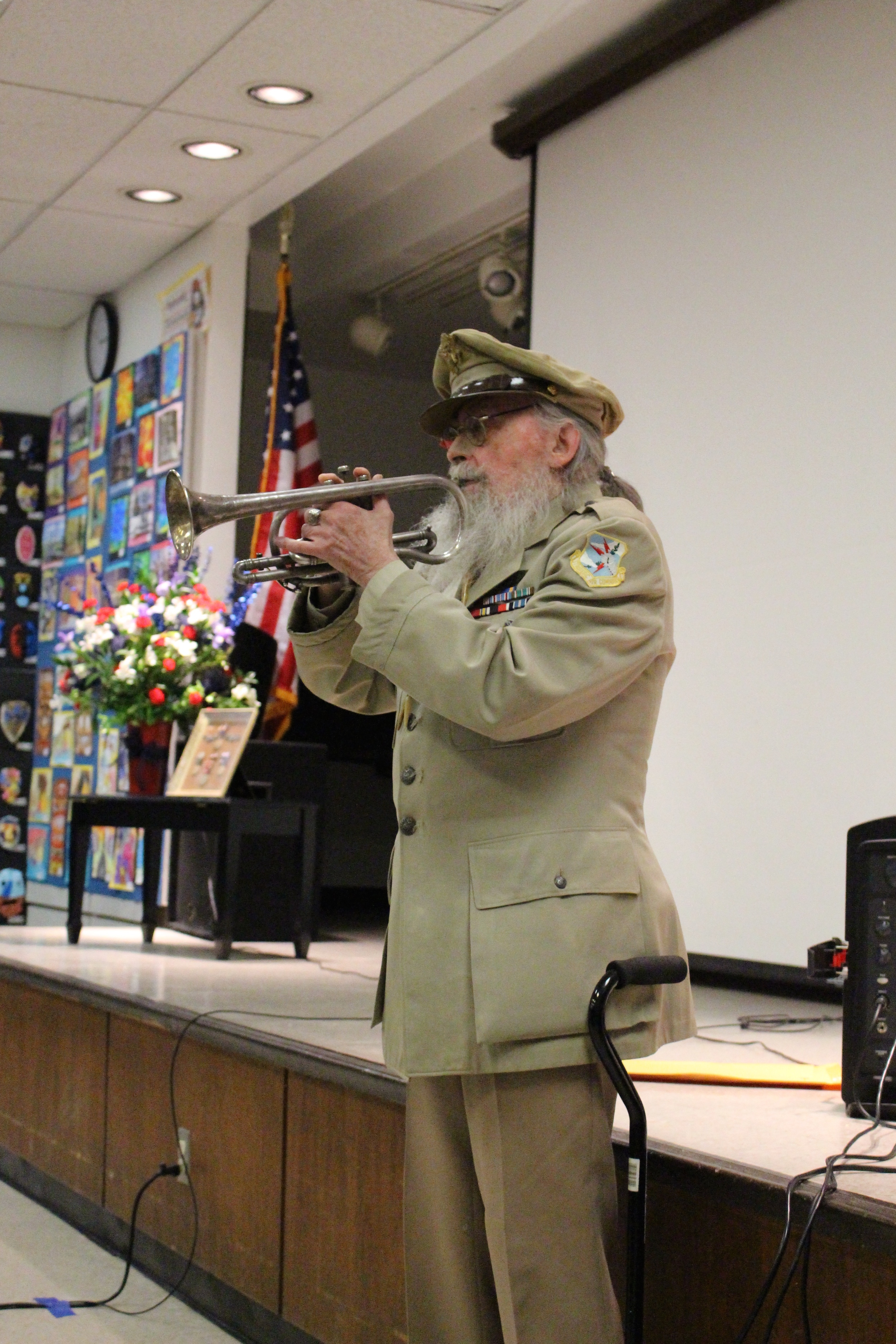 William Thomas, Jr., a B-17 pilot in the U.S. Army Corps during WWII, plays ‘Taps’ at the Veterans Testimonial Project at Half Hollow Hills Community Library on Saturday. 