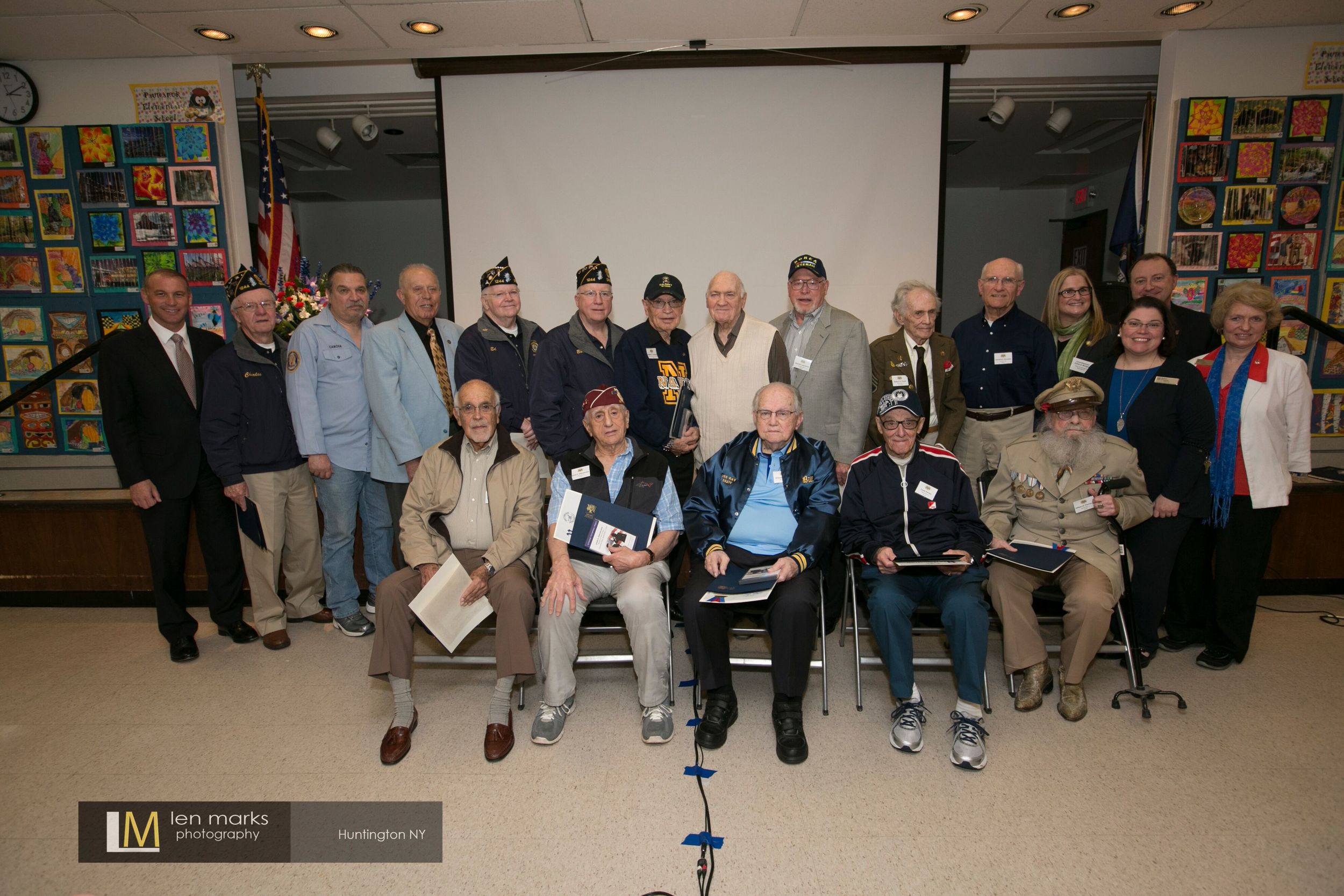 The second annual Veterans Testimonial Project ceremony honored 12 local veterans for their service in World War II, Korean War, Vietnam and peacetime. Top row, left to right: Suffolk Legislator Steve Stern; Charles Armstrong; Ed Canova; Friedel J. Grashoff; Edward O’Shea; Robert Santo; Herbert R. Tuckman; Gerald H. Weintraub; Morton Laurence; Robert A. Frank; Lawrence J. Schroeder; Huntington Councilwoman Susan Berland; Paul Hennings (representative of state Senator John Flanagan’s office). Bottom row, left to right: Harold S. Stulbaum; Joseph Abbondondelo; William E. Lauter; Louis Peretz; William W. Thomas Jr.; Executive Half Hollow Hills Community Library Director Helen Crosson; and Edna Susman, librarian. Photo by Len Marks