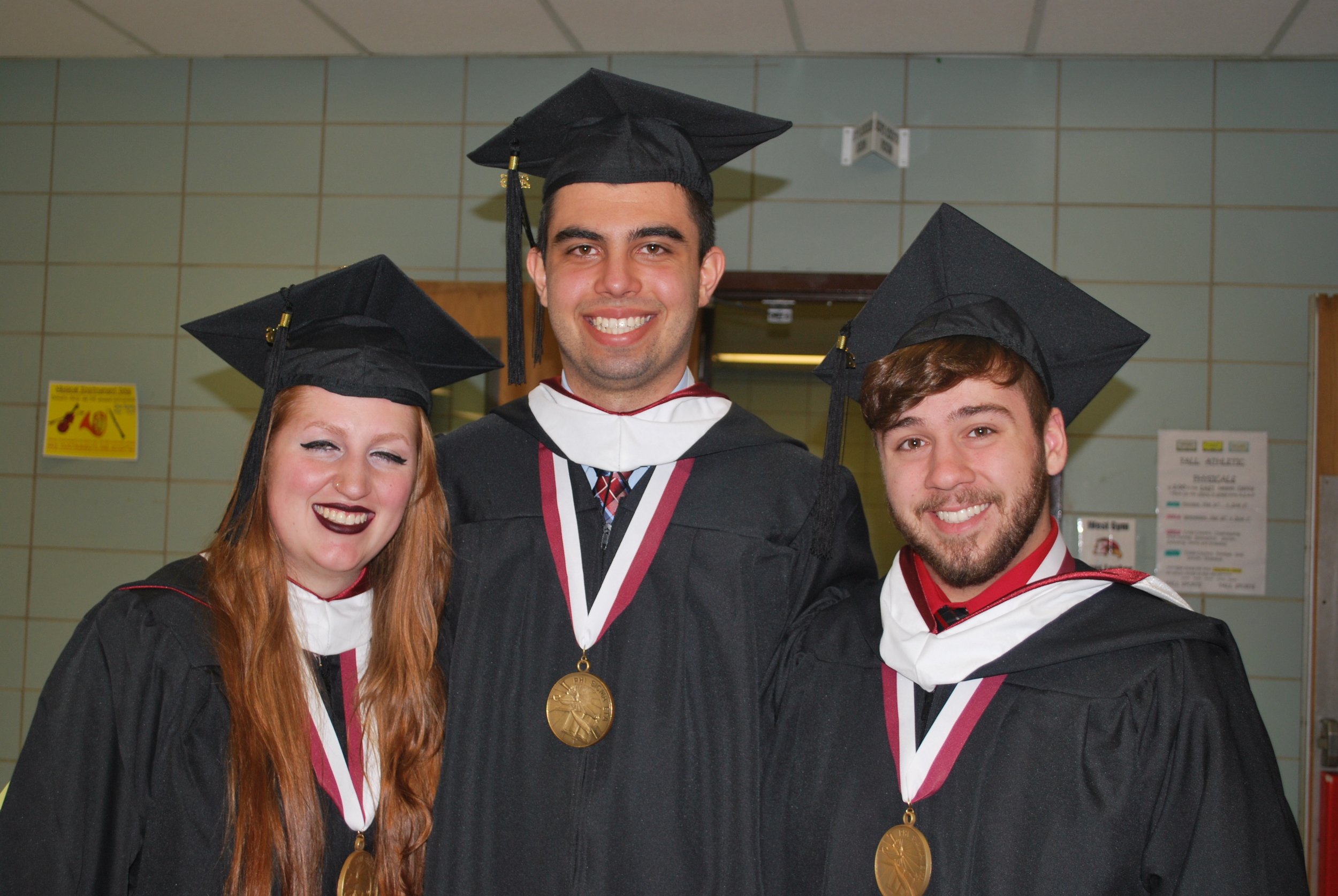 Five Towns recognized Valedictorian Melanie Magri, left, and Salutatorian Michael Makowski, center, are pictured with Kyle Young, a recipient of the Provost’s Award for outstanding academic achievement.