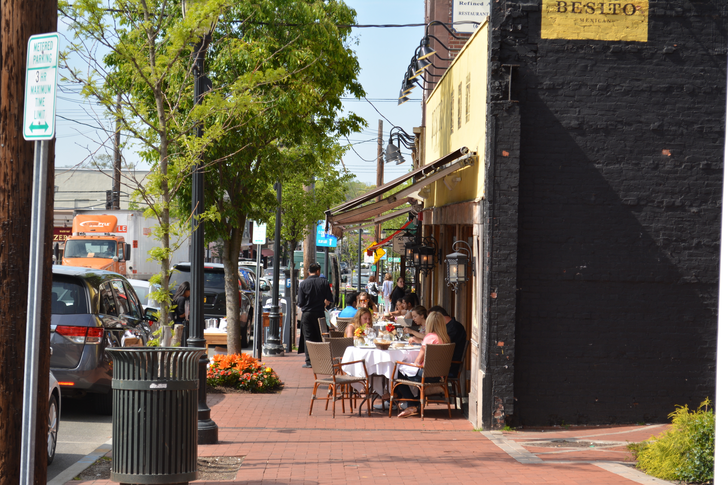 Crowds flock to sidewalks across town, including at Besito on New York Avenue in downtown Huntington.