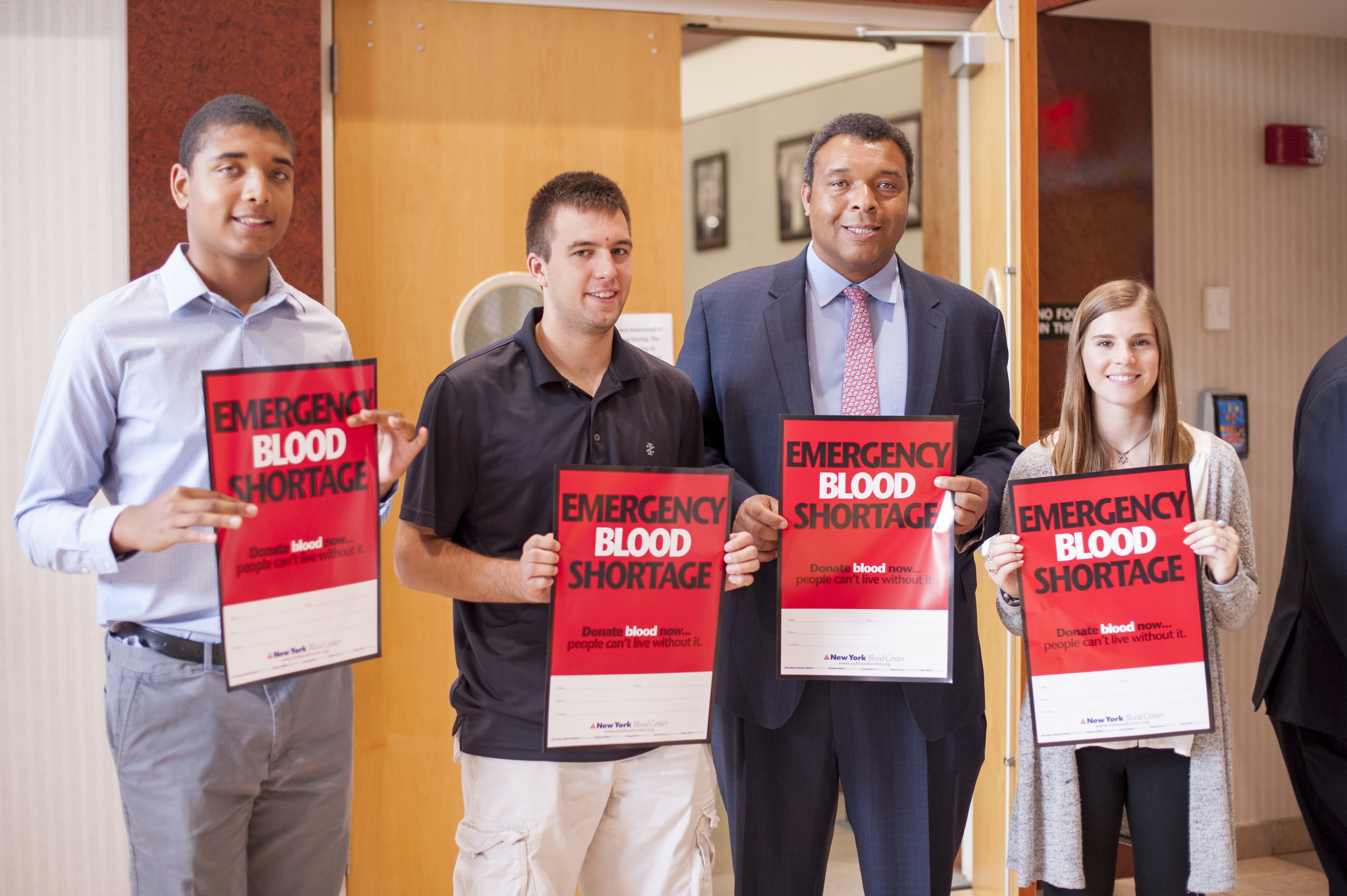 Suffolk Legislator William “Doc” Spencer announces a blood emergency on Friday. Spencer is pictured with interns, from left: Robbie Spencer, who’s also the legislator’s son; Alex Noon; and Hannah Willen. 