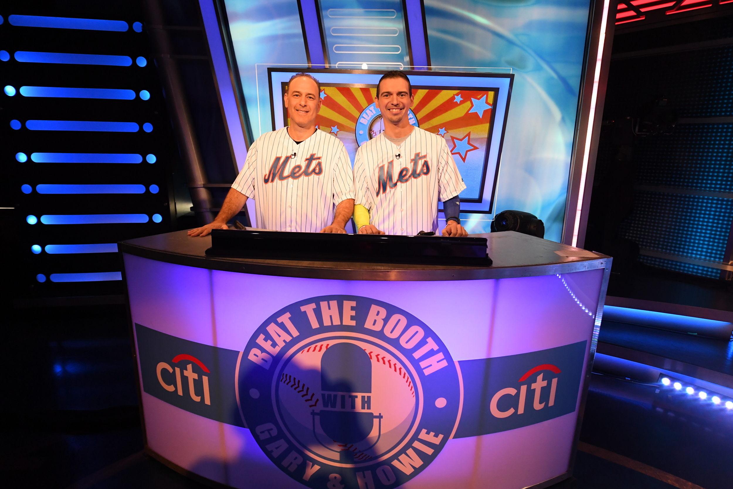Adam Yanover, left, of Melville, is pictured on the set of trivia game show “Beat the Booth” with teammate Anthony Furia, of Brooklyn.