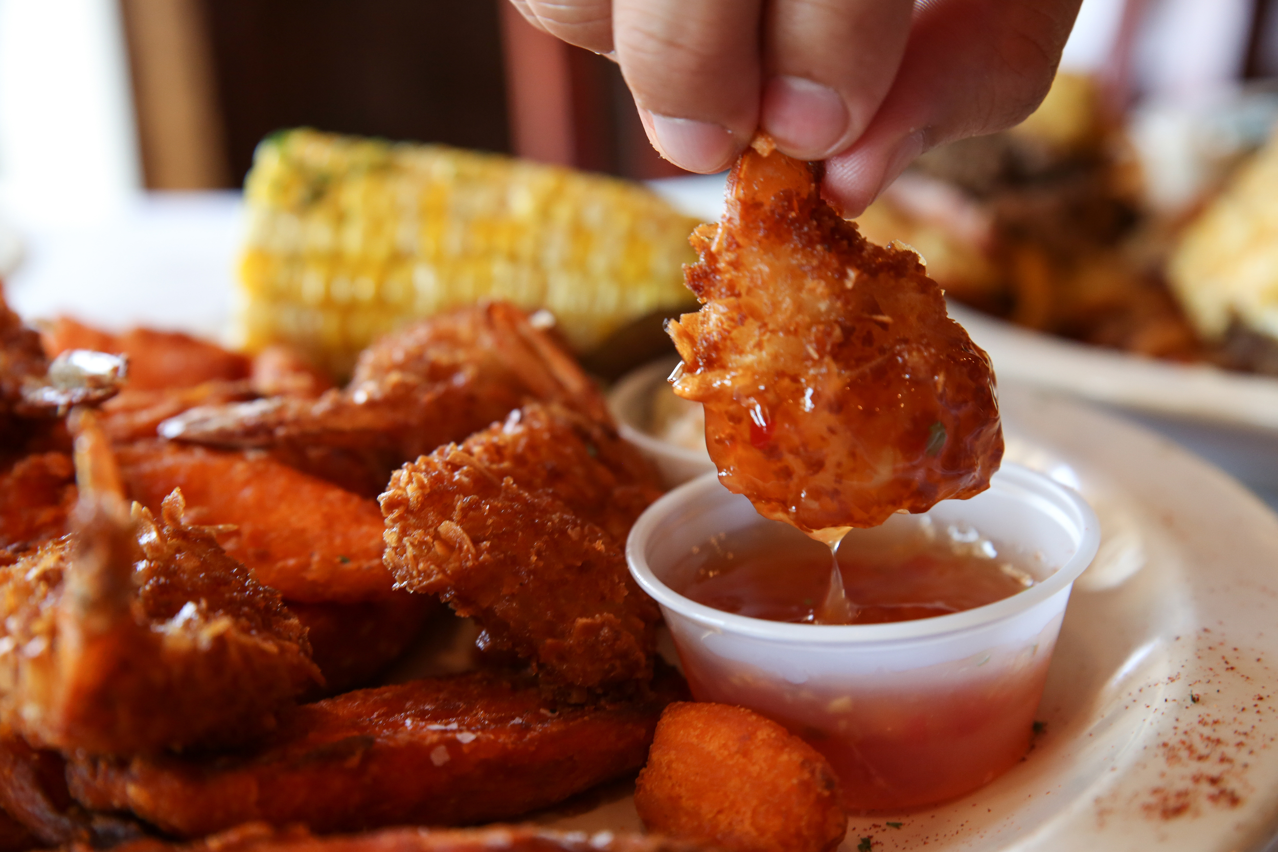 Sweet chili sauce is a perfect complement for the Fried Coconut Shrimp, served with a side of thick-slice sweet potato fries, as well as corn on the cob.