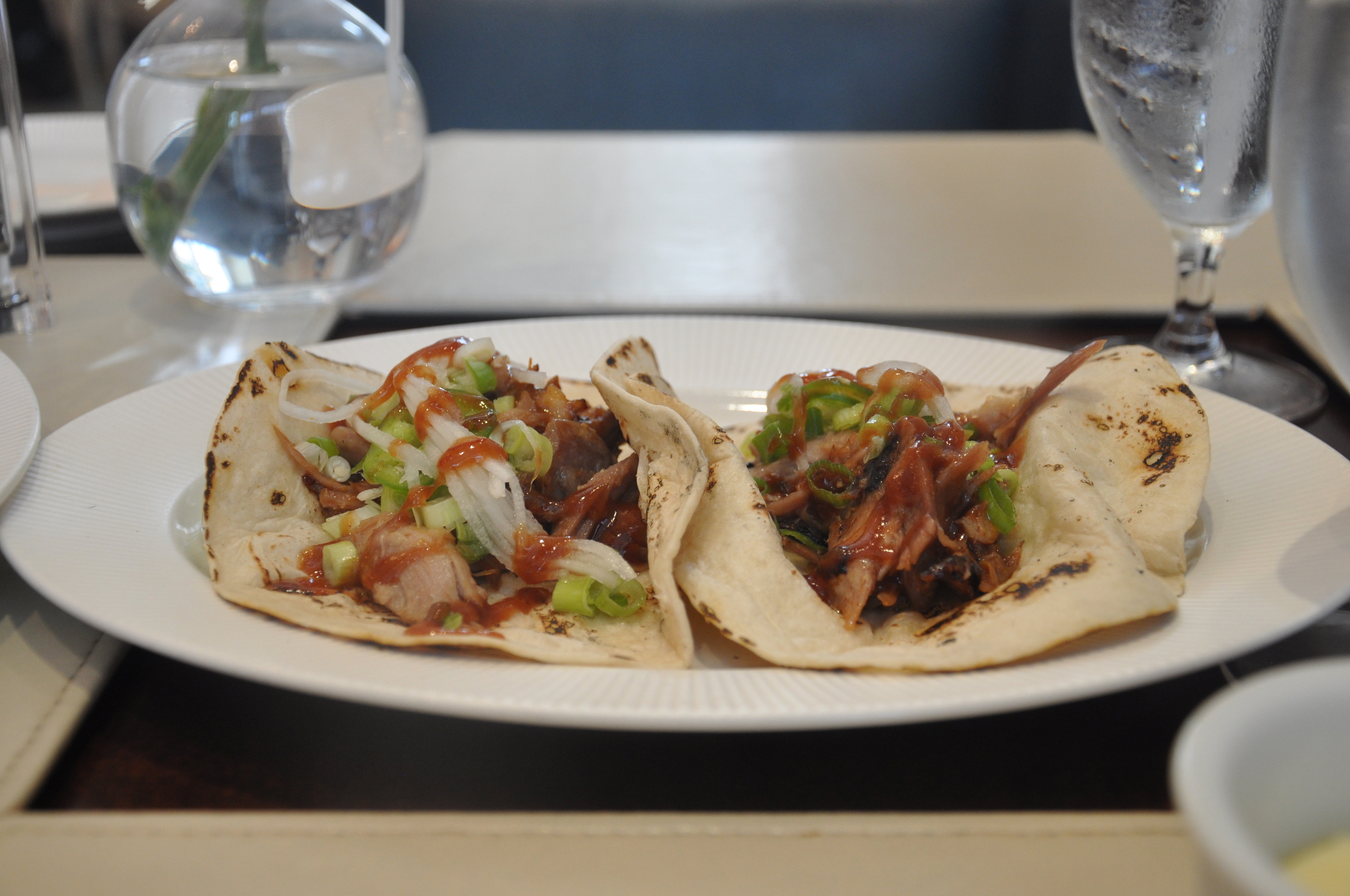 Sandbar’s duck tacos are filled with pulled duck, daikon, and jalapeno and topped with hoisin sauce.