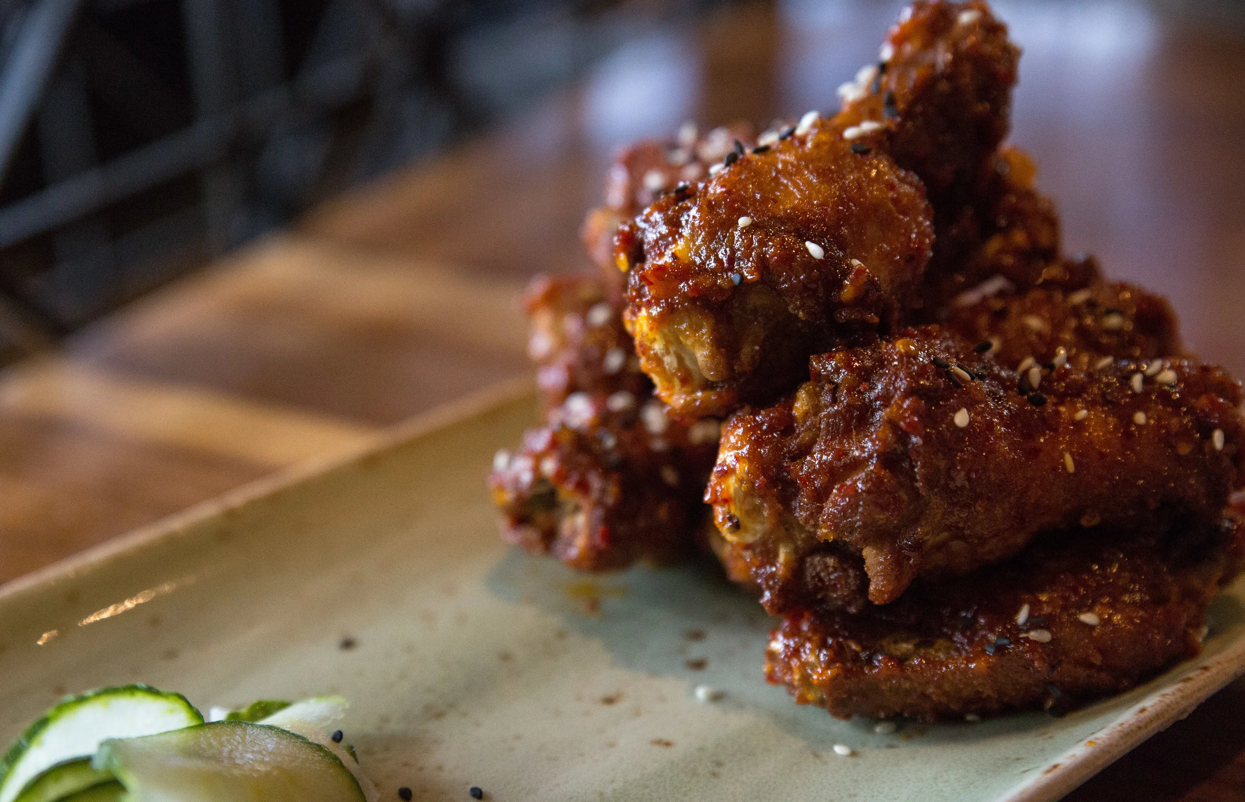 Long Islander News photos/Craig D’Andrea The slightly crunchy skin of the Hunan Dragon Wings gives way to a textured chicken that has been imbued with Hunan spice and chili jam to pack a punch of spiciness that's balanced out by the side of pickled vegetables.