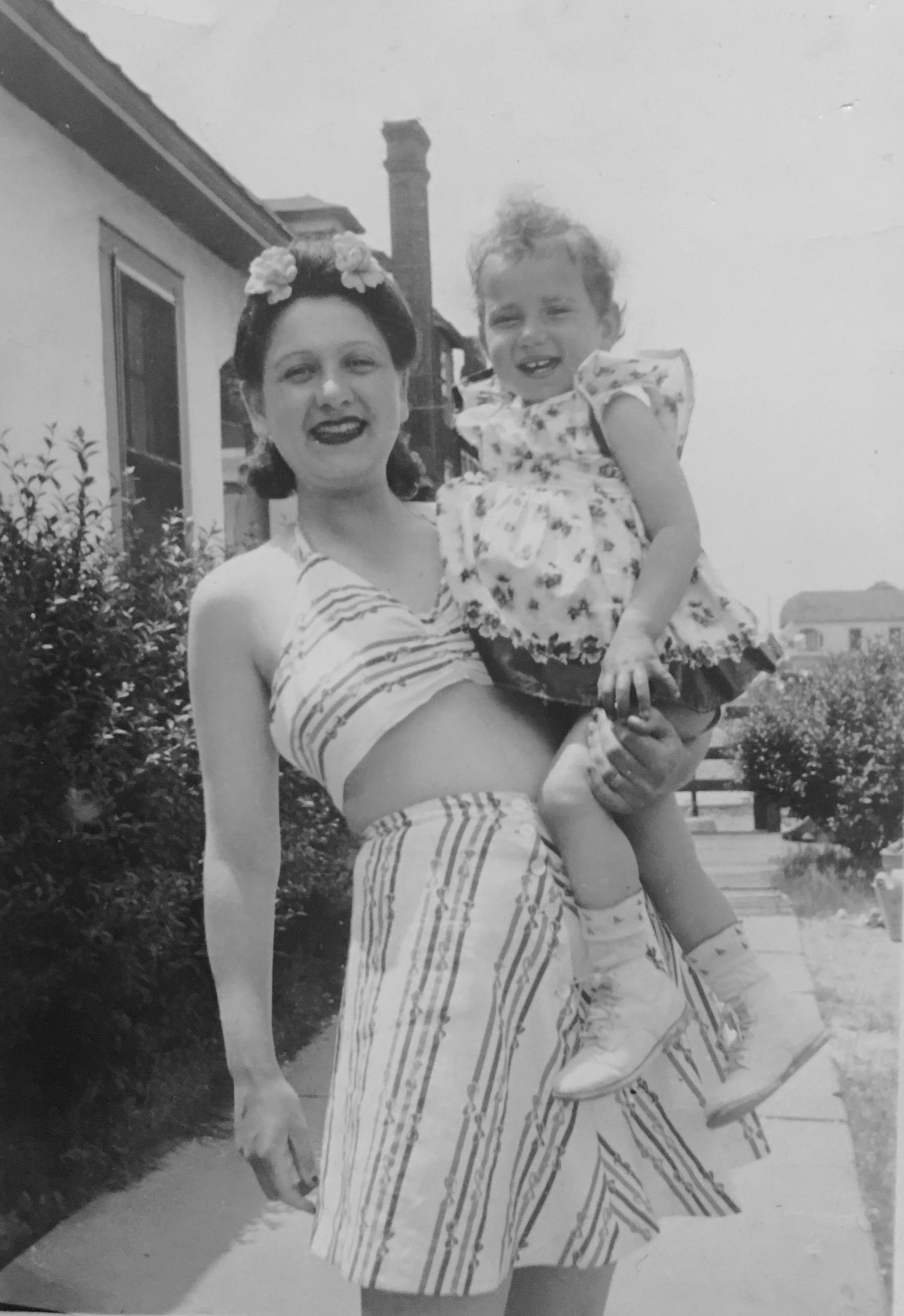 Photo courtesy of Phyllis Nicole Udinsky Beatrice Halperin, left, a Dix Hills resident who just celebrated her 100th birthday, holds her daughter, Phyllis Nicole Udinsky, at a beach in New York circa 1946.