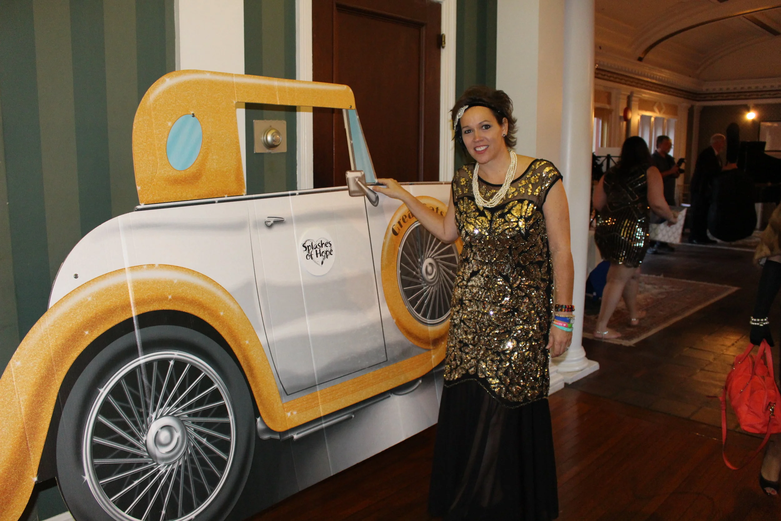 Long Islander News photos/Janee Law Heather Buggee, founder and director of Huntington-based Splashes of Hope, brings Roaring Twenties style to Coindre Hall as the nonprofit hosted its 20th anniversary gala.