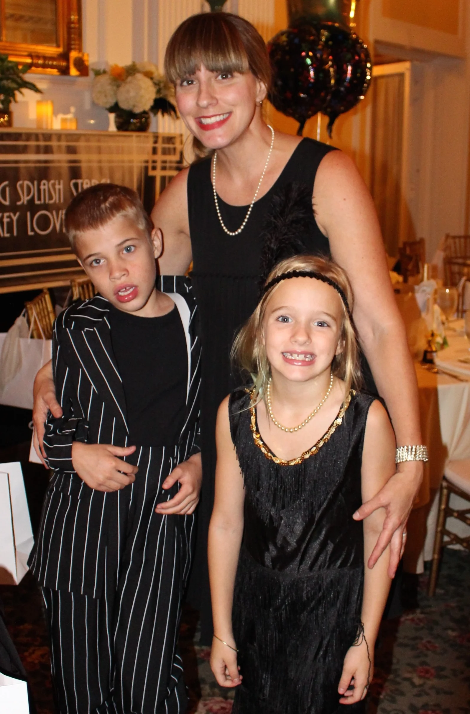 Long Islander News photos/Janee Law Heather Buggee, founder and director of Huntington-based Splashes of Hope, brings Roaring Twenties style to Coindre Hall as the nonprofit hosted its 20th anniversary gala.
