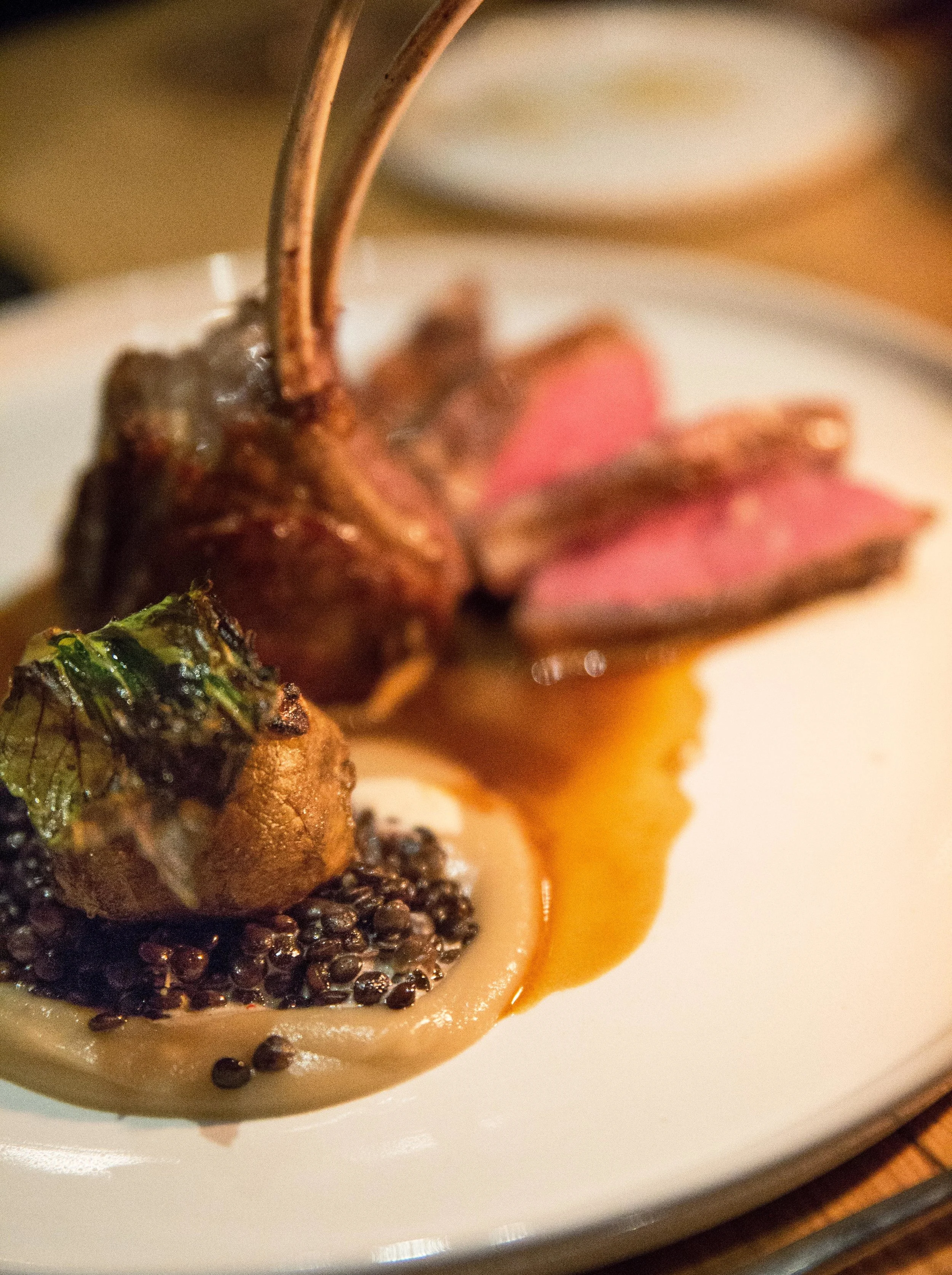 The Colorado Lamb plates sunchoke, beluga lentils and yogurt with cumin. The lamb has an aromatic, bold flavor that matches well with the nutty beluga lentils.