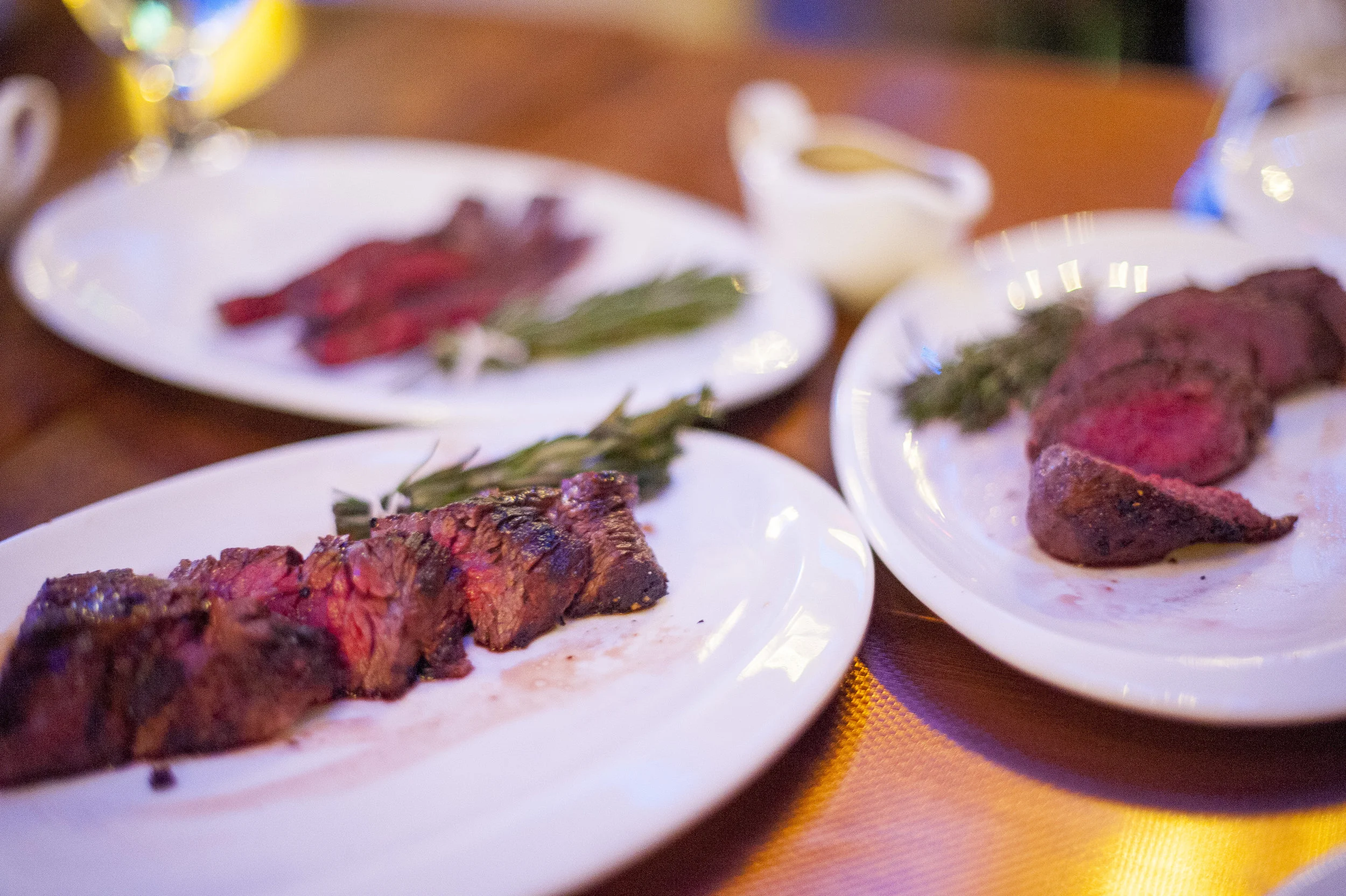 IMC serves these three cuts of Wagyu steak with bundles of rosemary and thyme to dip into a side of au jus sauce made from the beef’s own juices.