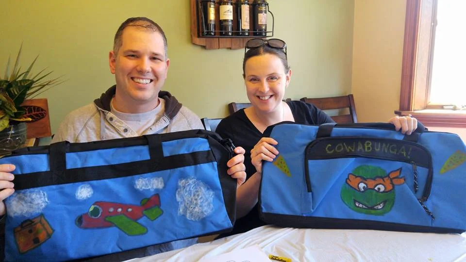  Frank and Maegan Garvey, both of Huntington village, decorate their sweet cases as part of Rachael Risinger’s mission. 
