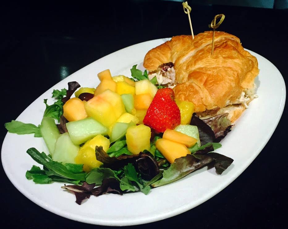  Honu’s Waldorf chicken salad with gala apples, walnuts, and celery on a buttery croissant. 