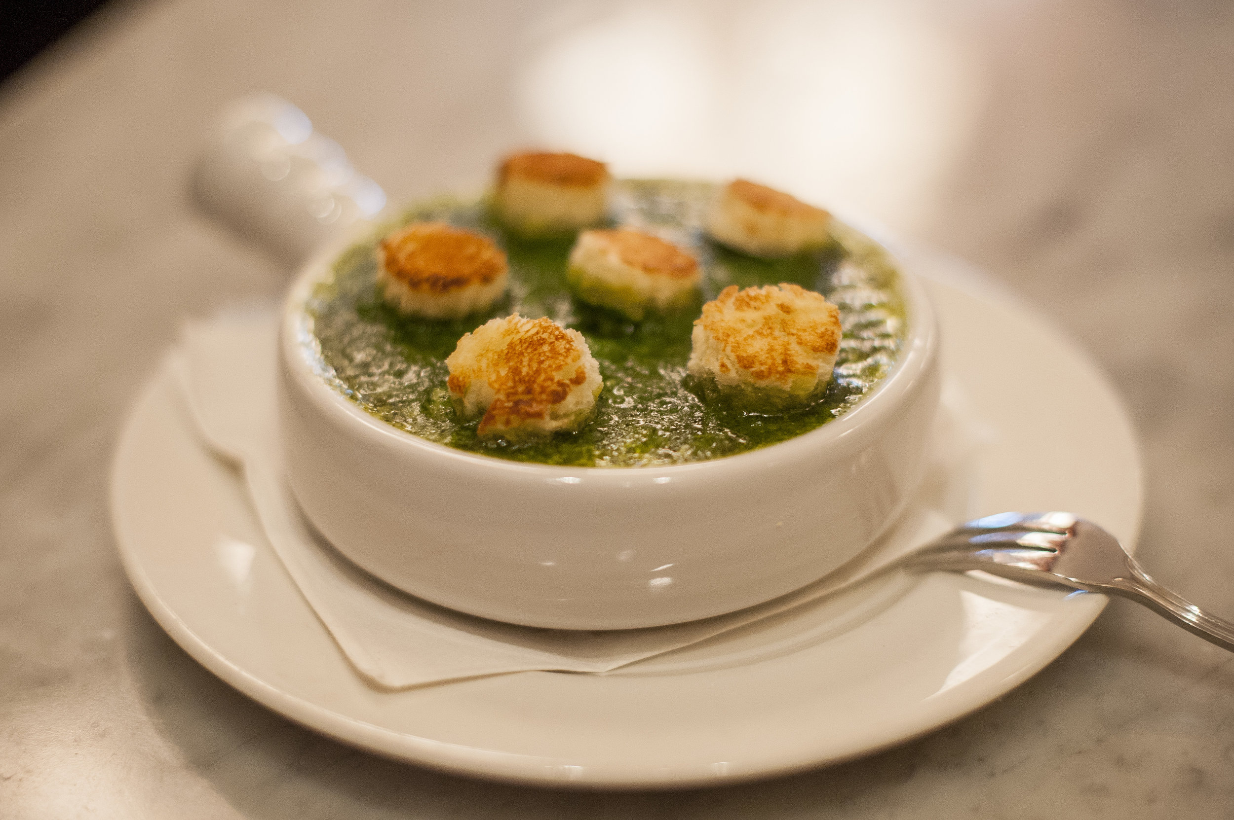  An authentic take on a French staple, the Escargots Persilles are baked snails and garlic herb butter, topped with bread croutons. 