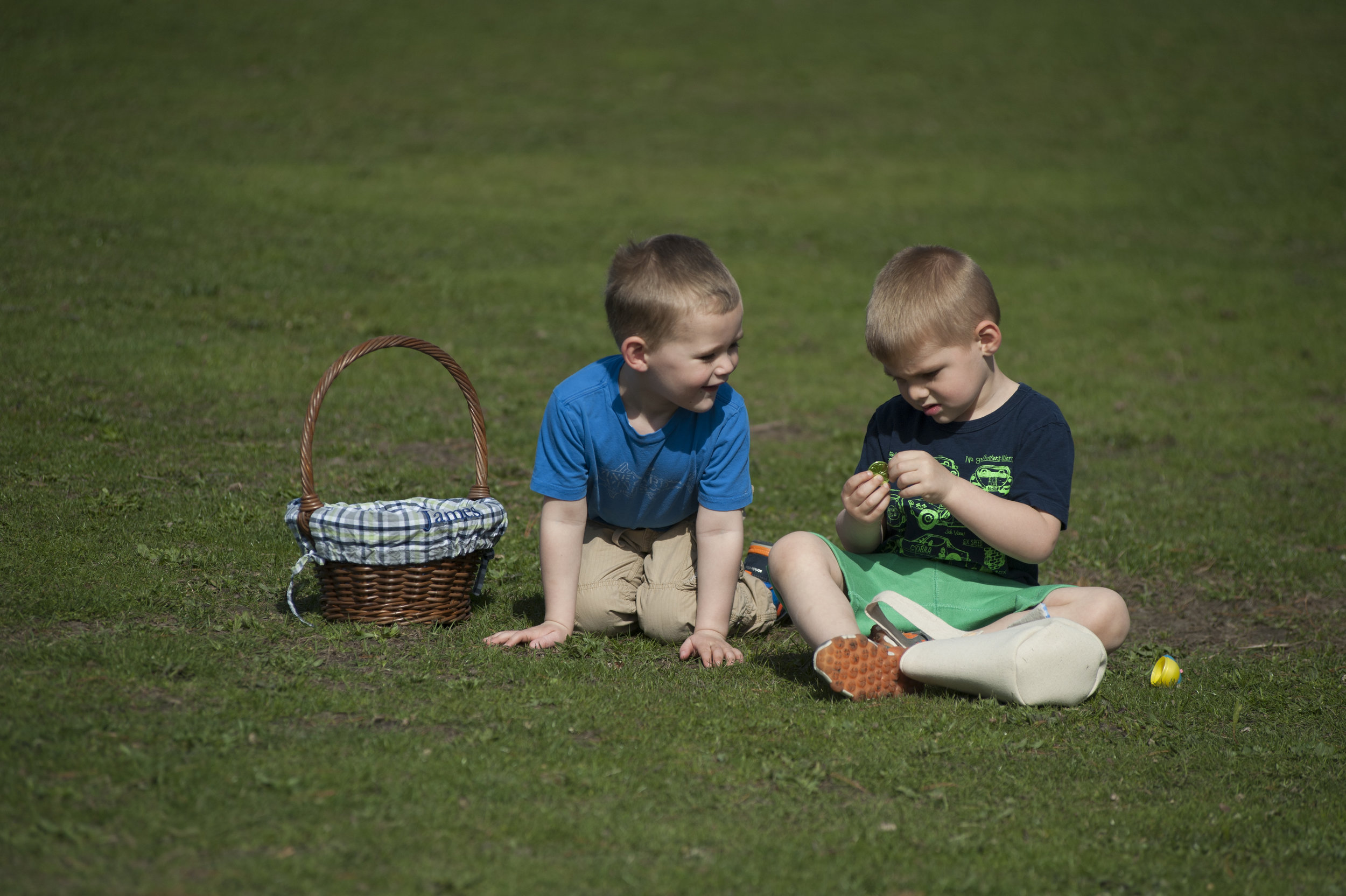  Two brothers rummage through their Easter eggs to see what candy and toys lie within at ‘Eggstravaganza,’ at Heckscher Park Tuesday. Scores of children participated in the egg hunt, and annual event hosted by the Town of Huntington. 