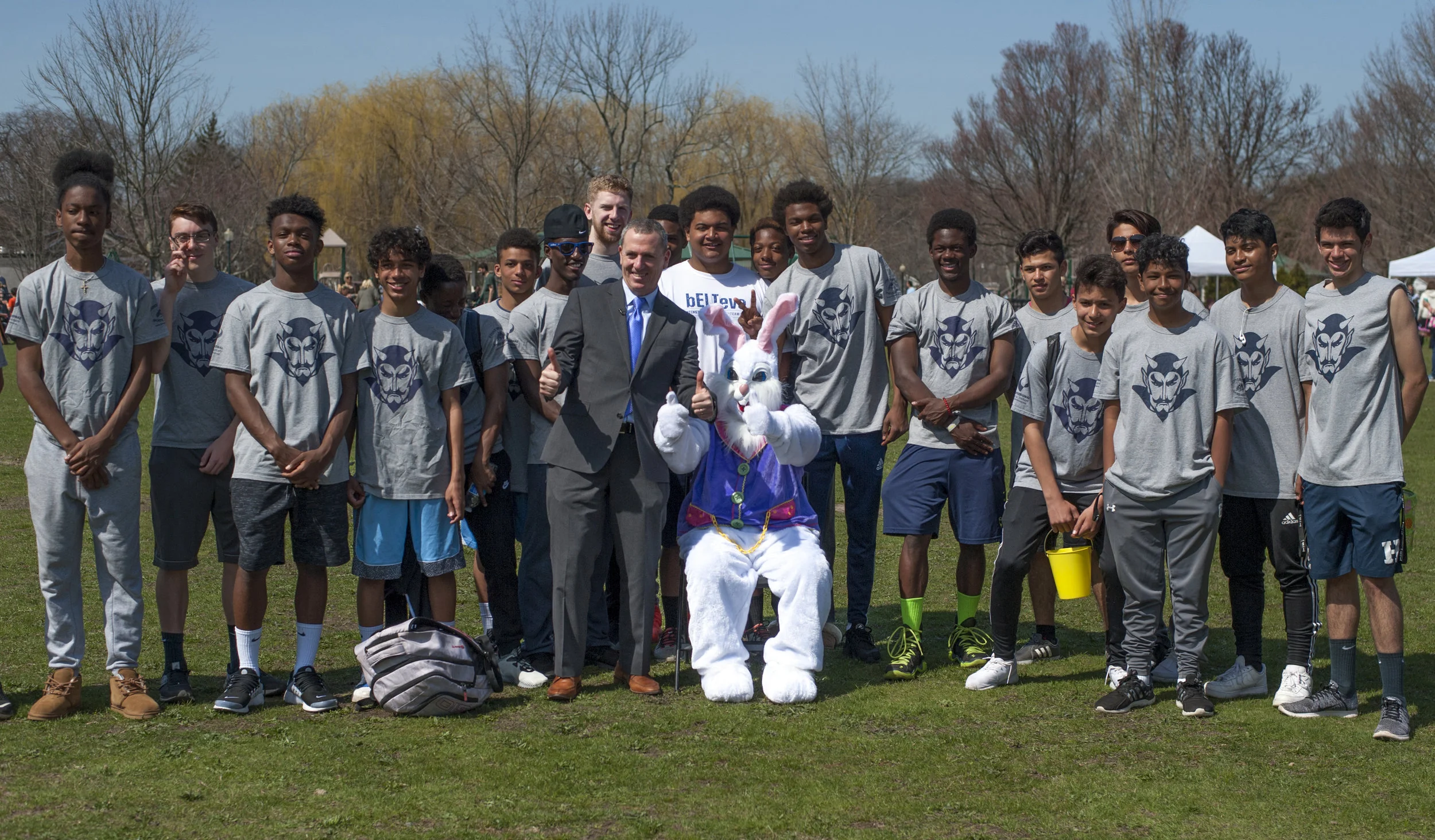 Councilman Mark Cuthbertson, sponsor of the annual egg hunt, stands with the Easter Bunny and volunteers from the Huntington track team. 