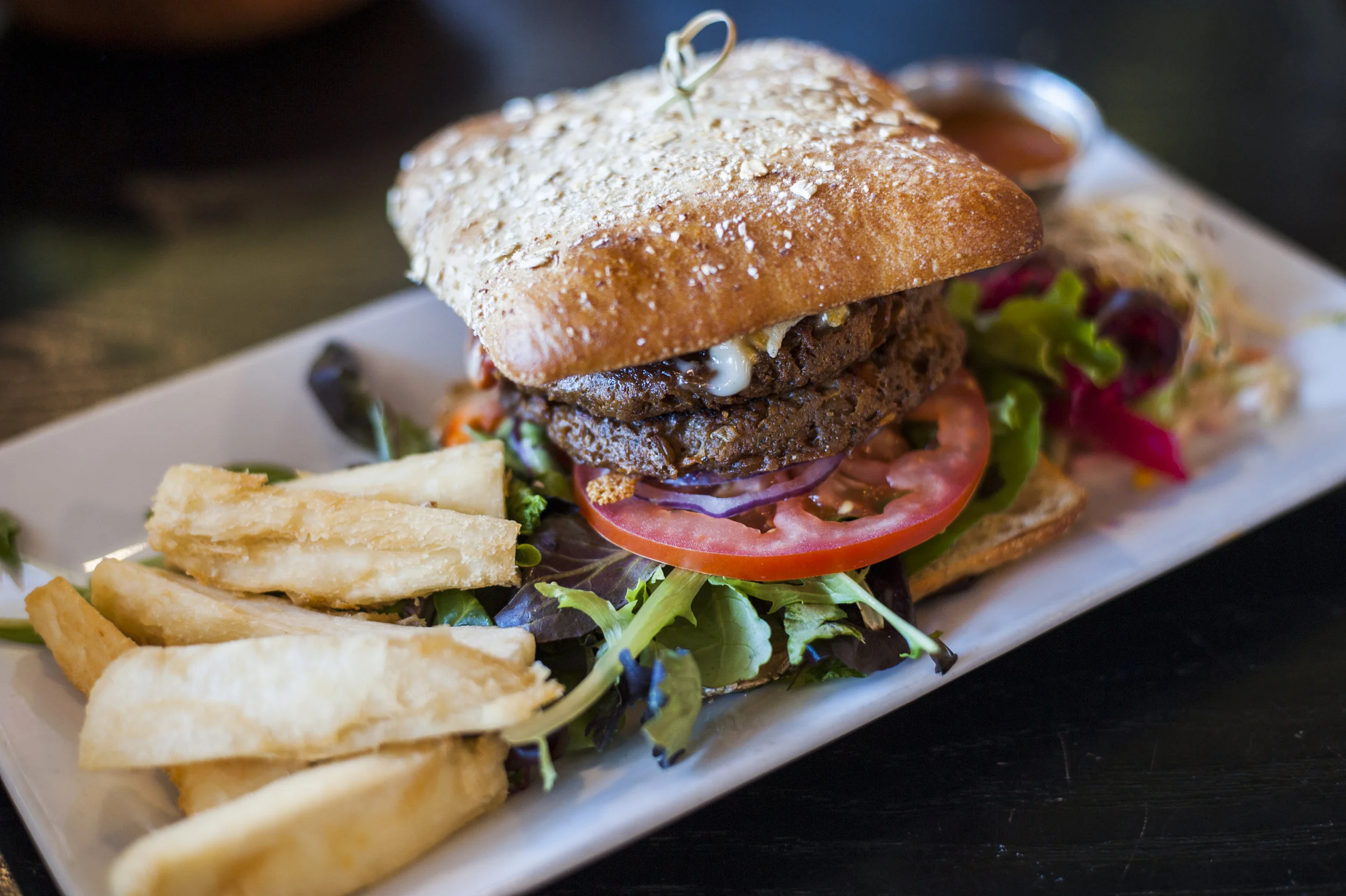  Between whole wheat ciabatta, The Proper Whopper brings together vegan burger patties, melted vegan cheese, secret sweet &amp; spicy sauce, red onion, tomato, organic baby greens with a helping of yuca fries. 