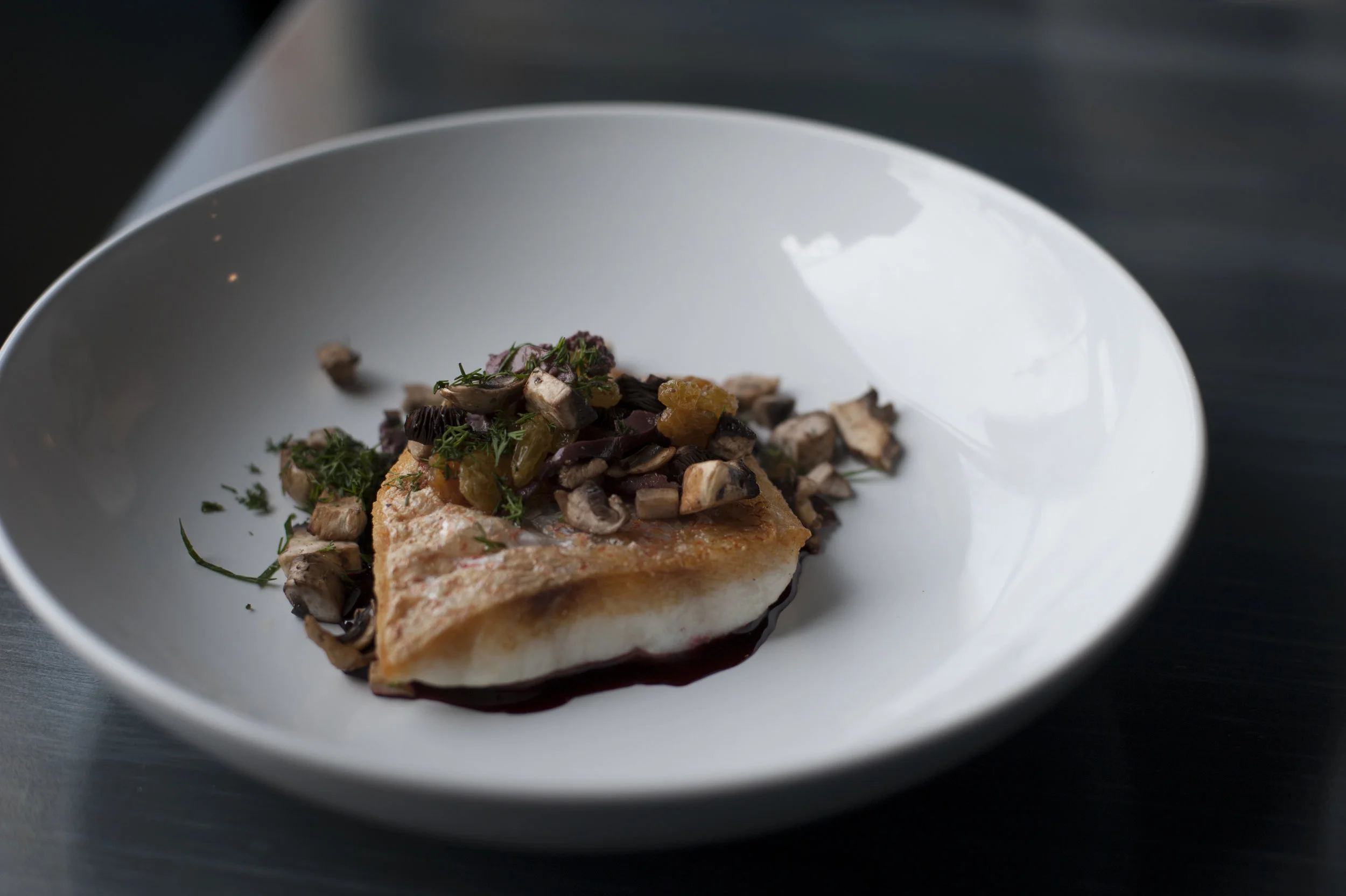  The Mediterranean Red Snapper brings together fillet of red snapper served with red beet beurre blanc sauce, topped with olives, golden raisins and mushrooms for a rich and complex dish. 