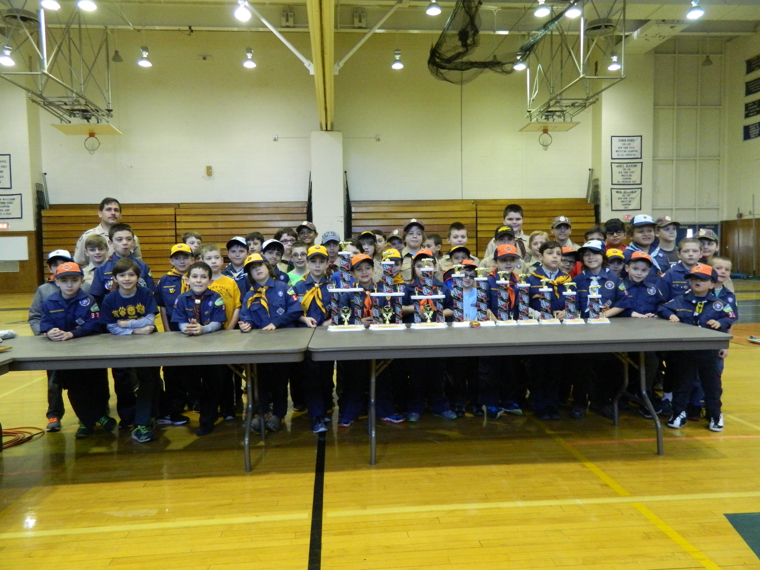  Prior to the start of the Matinecock District’s annual 2017 Pinewood Derby race, all of the participating Tigers, Cubs, and Webelos pose for a photo with the trophies. 