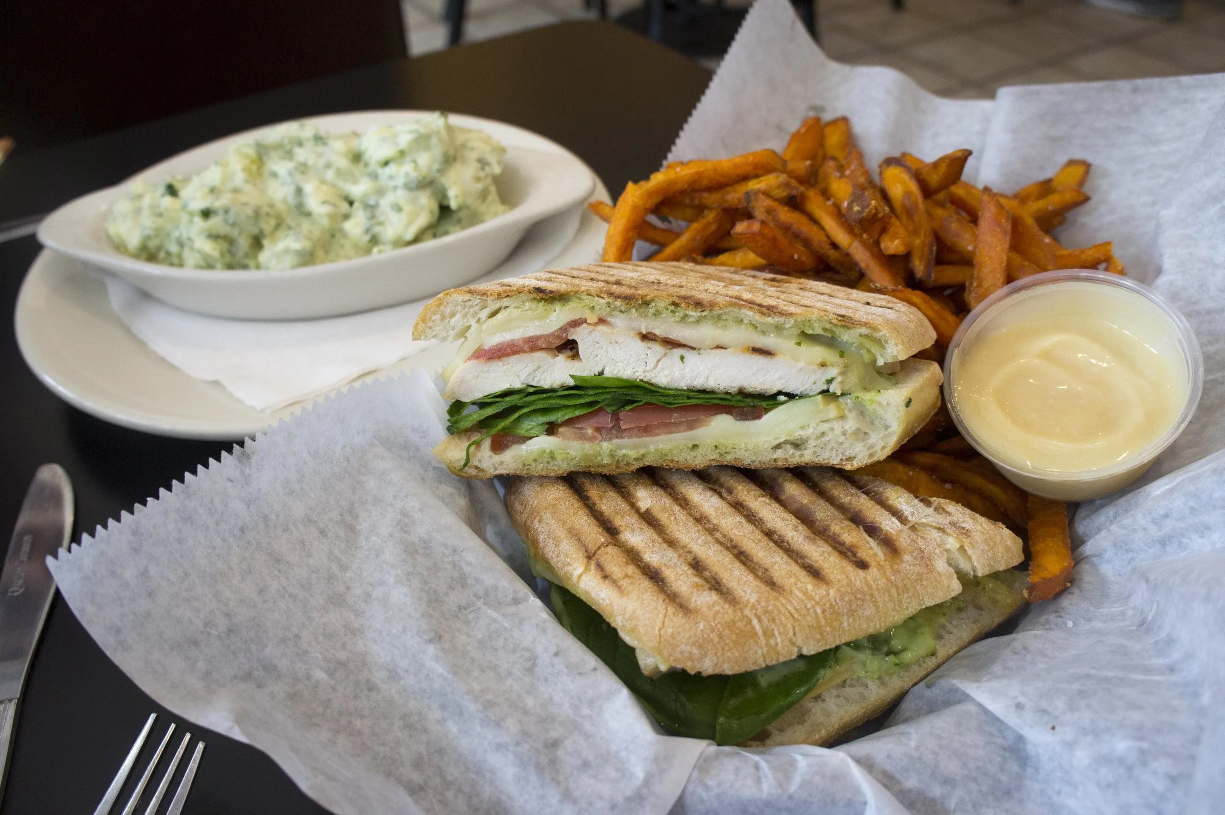  The Mobster Panini ($8.95), with grilled chicken breast, smoked mozzarella, fresh baby spinach, tomato and basil pesto mayo, offers a crunchy bite, with a soft and juicy center. 