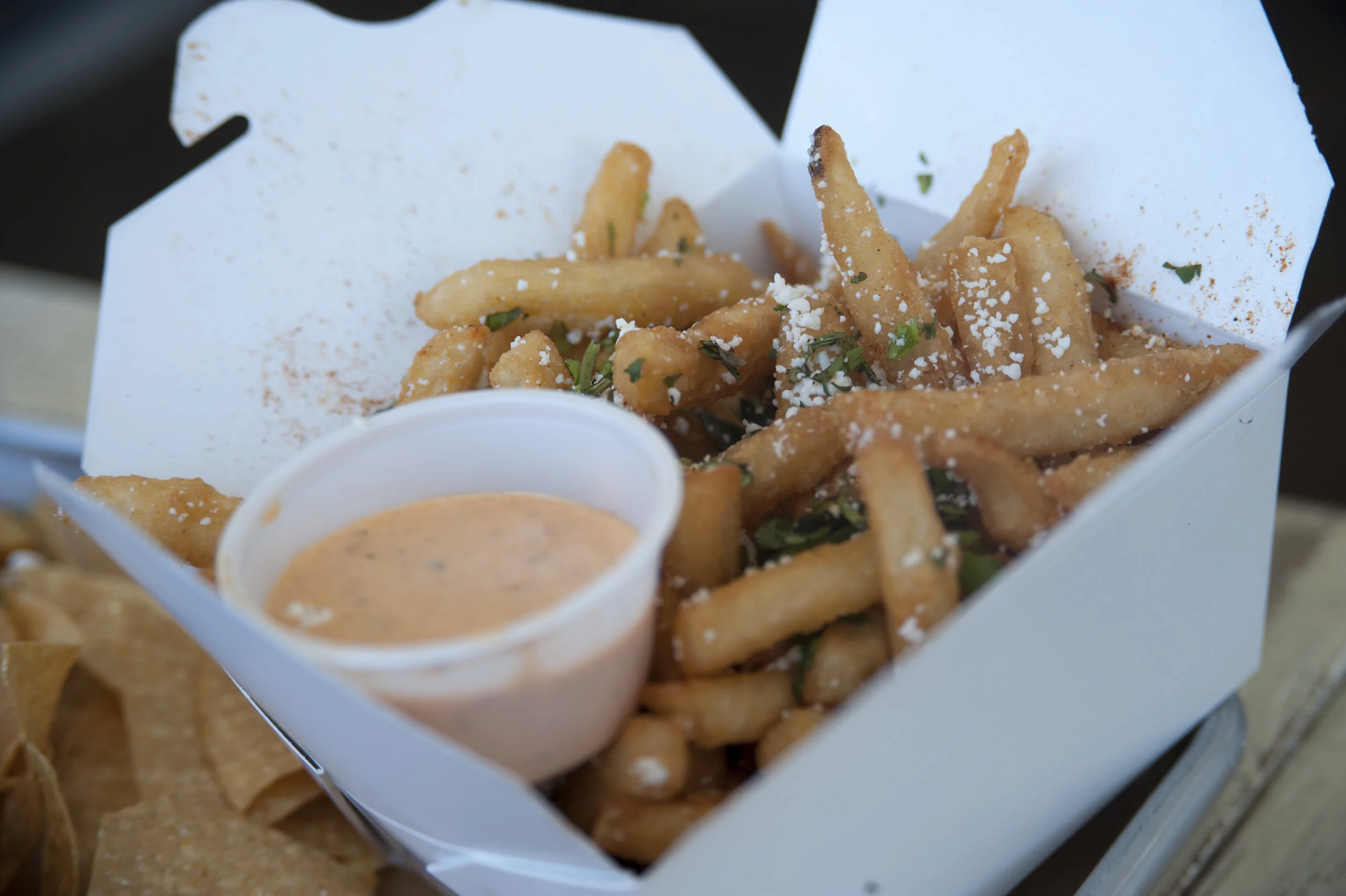  The Street Fries offers crispy fries topped with cotija, sea salt, cilantro and tajin, a Mexican seasoning, alongside the signature Whale Sauce.    