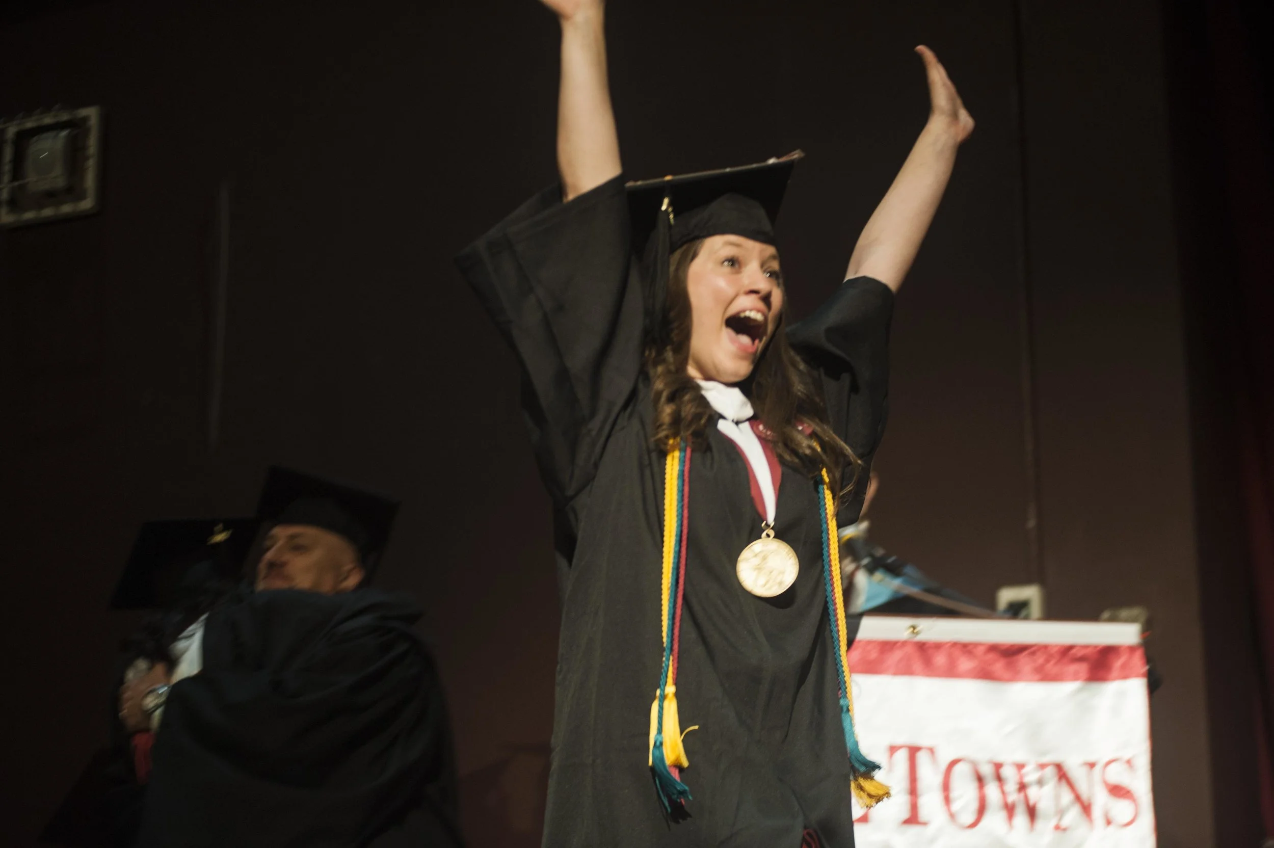  Graduate Ashley Ferraro celebrates after receiving her degree. 