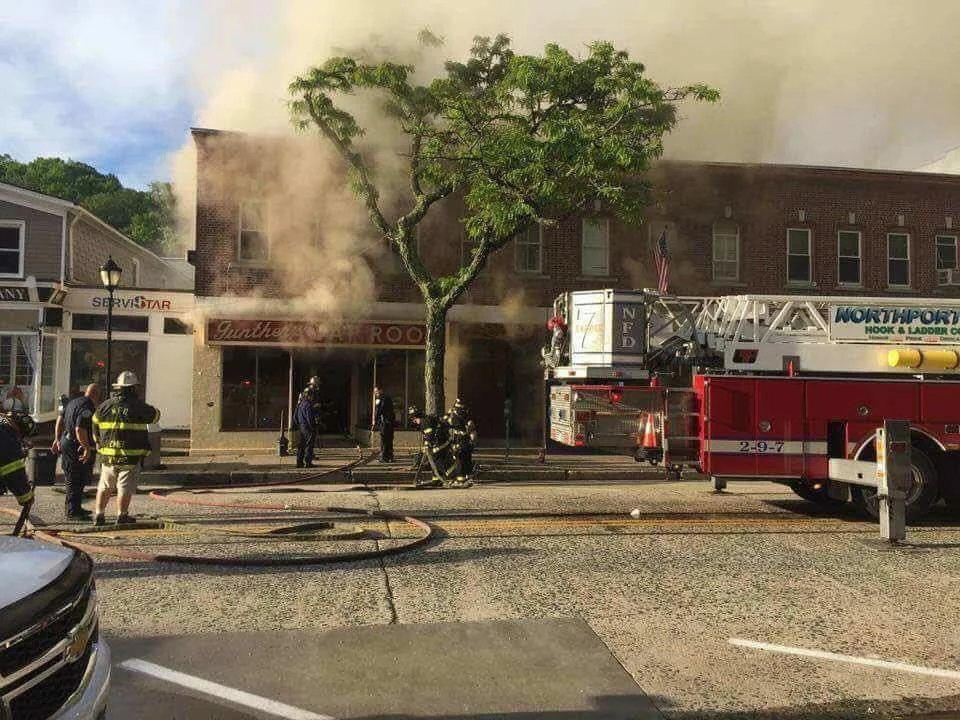  Photo by Chris Ciaci   Firefighters respond Tuesday to a fire that gutted Gunther’s Tap Room, and affected two neighboring businesses and apartments on the second floor. 